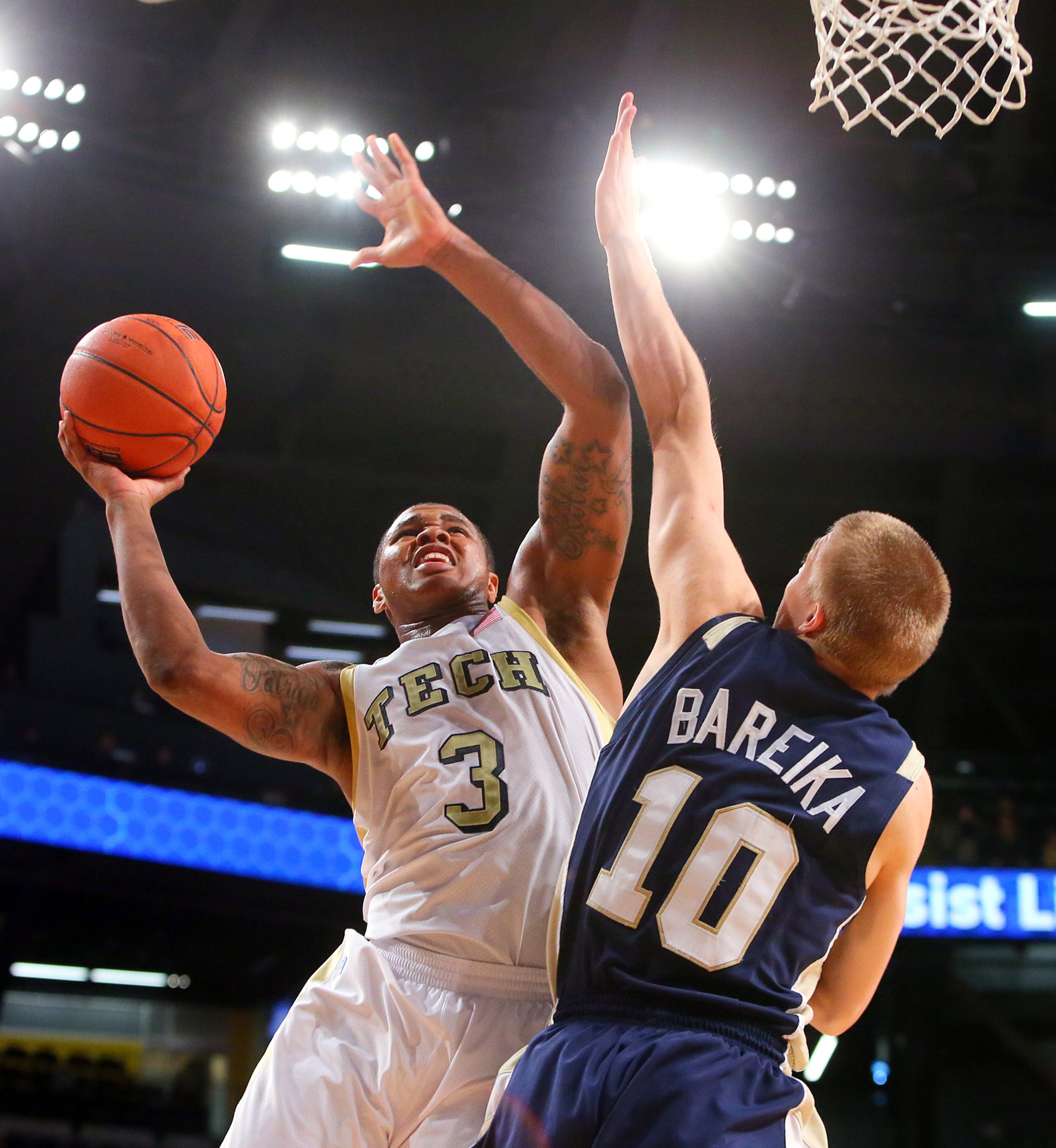 Georgia Tech guard Marcus Georges-Hunt shoots over Chattanooga Mocs defender Martynas Bareika during second half action at McCamish Pavilion in Atlanta on Wednesday, Jan. 2, 2013. CURTIS COMPTON / CCOMPTON@AJC.COM