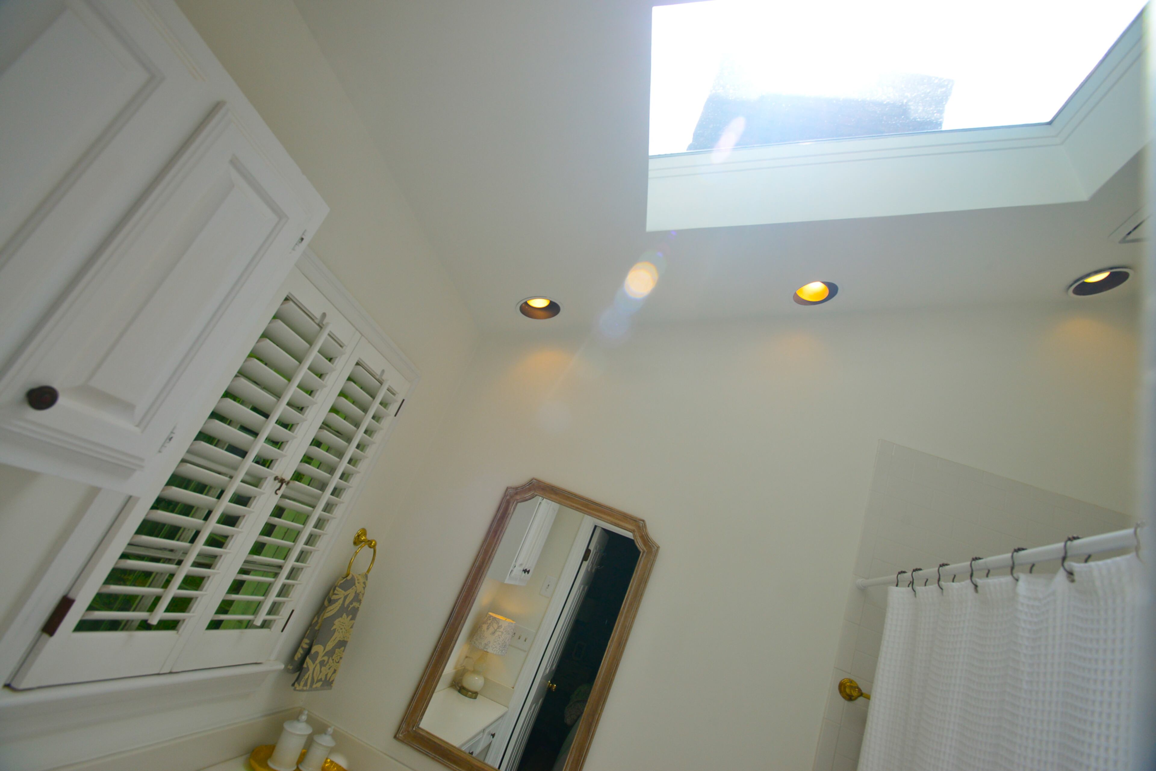 A skylight is another way that natural light comes into the Buckhead home, even into spaces such as the bathroom.