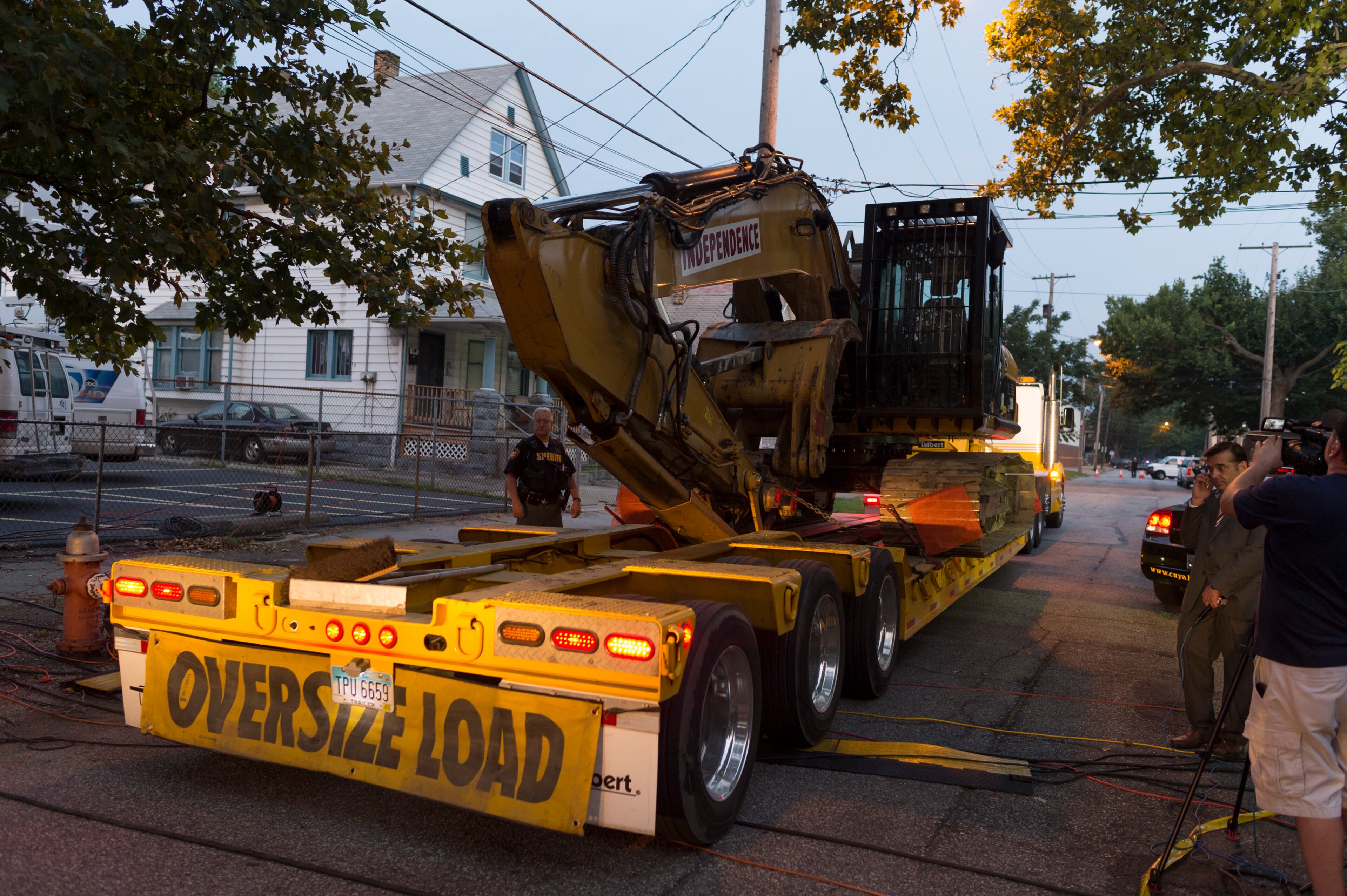 Demolition crews arrive at the home of Ariel Castro on August 7, 2013 in Cleveland, Ohio.