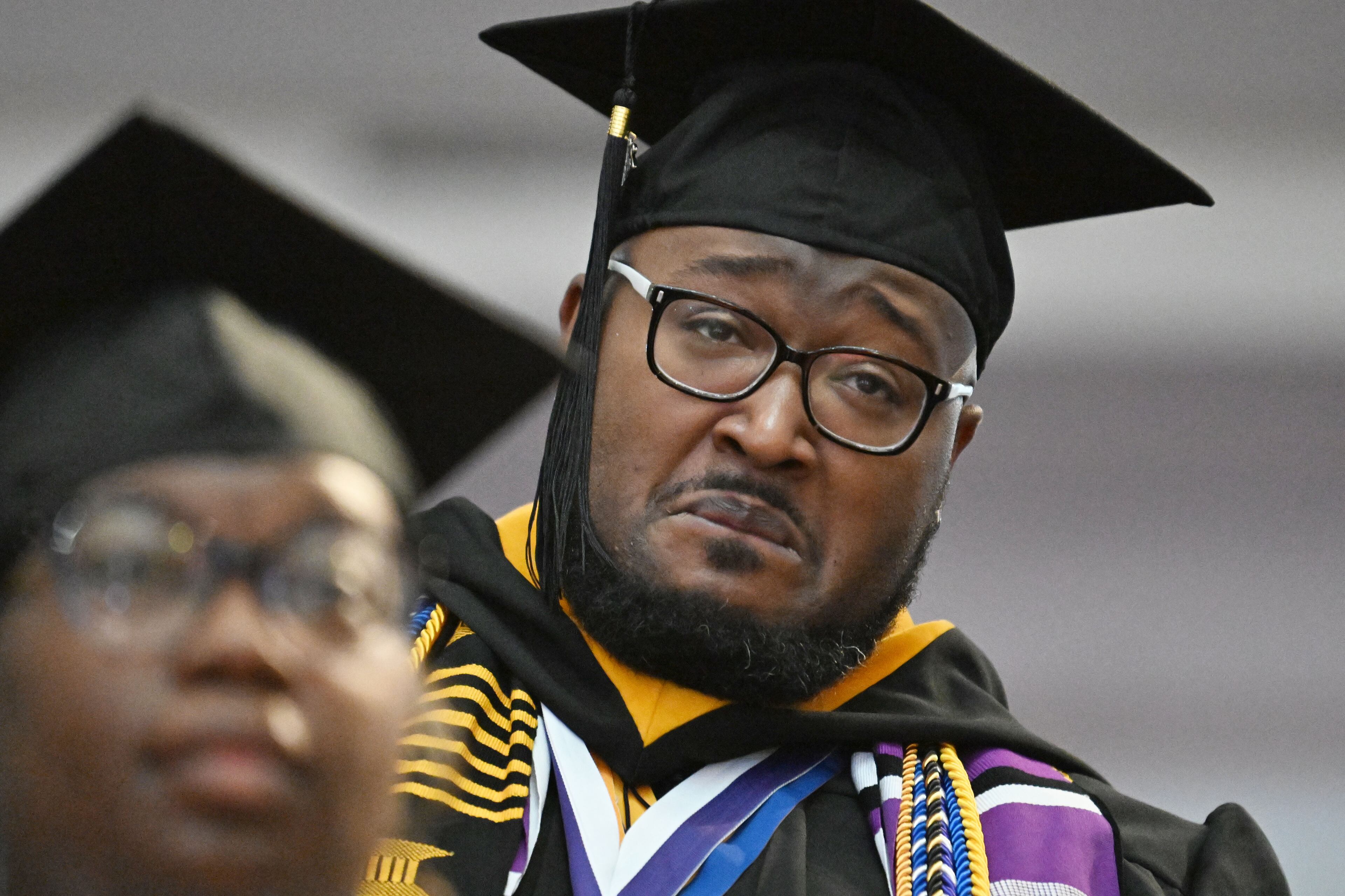 Graduates react as Bishop T.D. Jakes delivers a commencement address during 2025 Morris Brown College commencement exercises at Saint Philip A.M.E. Church, Saturday, May 17, 2025, in Atlanta. (Hyosub Shin / AJC)