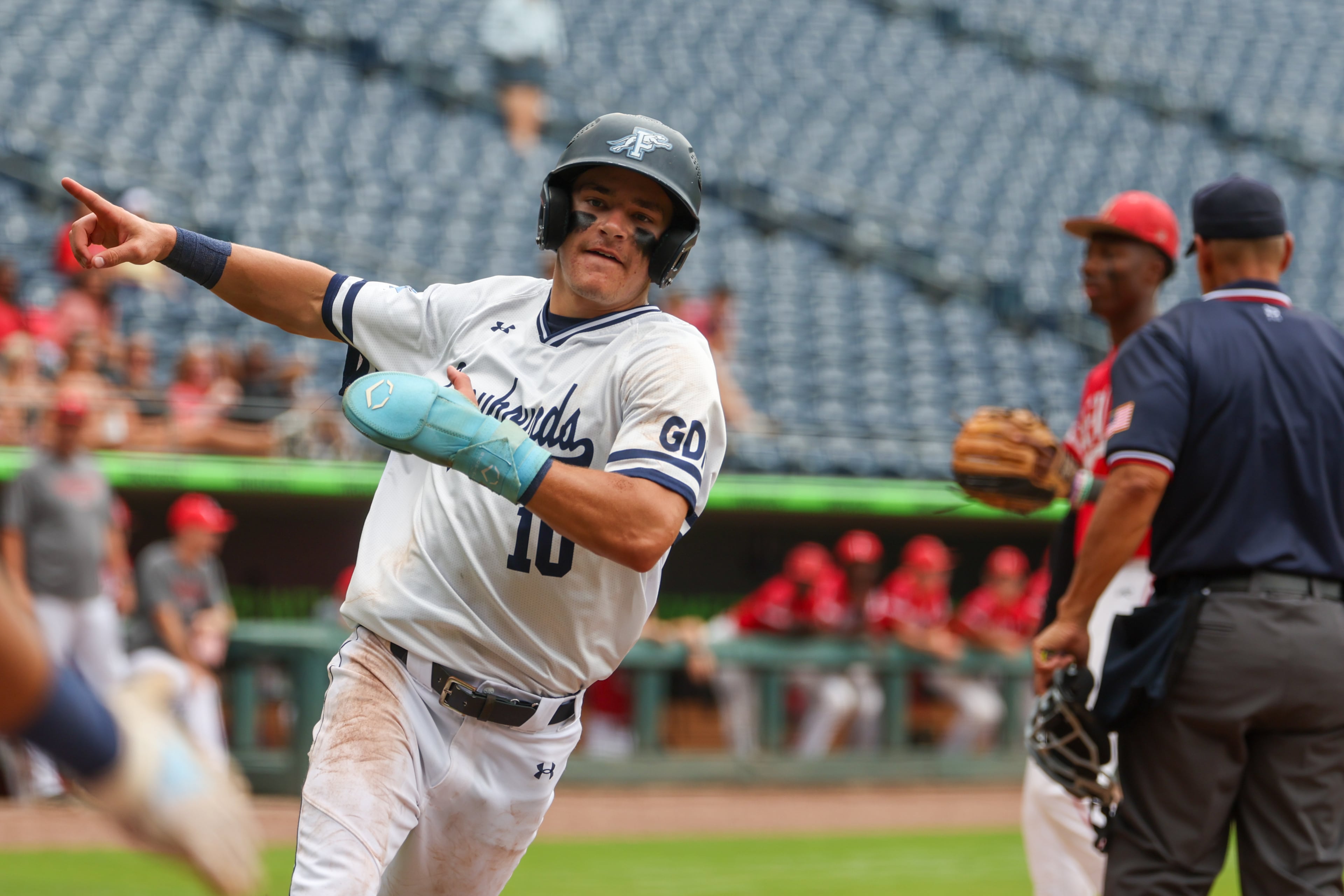 Pope’s Parker Troughton scores in Game 2 of their GHSA Class 5A baseball championship series against Loganville at Gwinnett Field on Tuesday, May 26, 2026, in Lawrenceville. (Arvin Temkar/AJC)