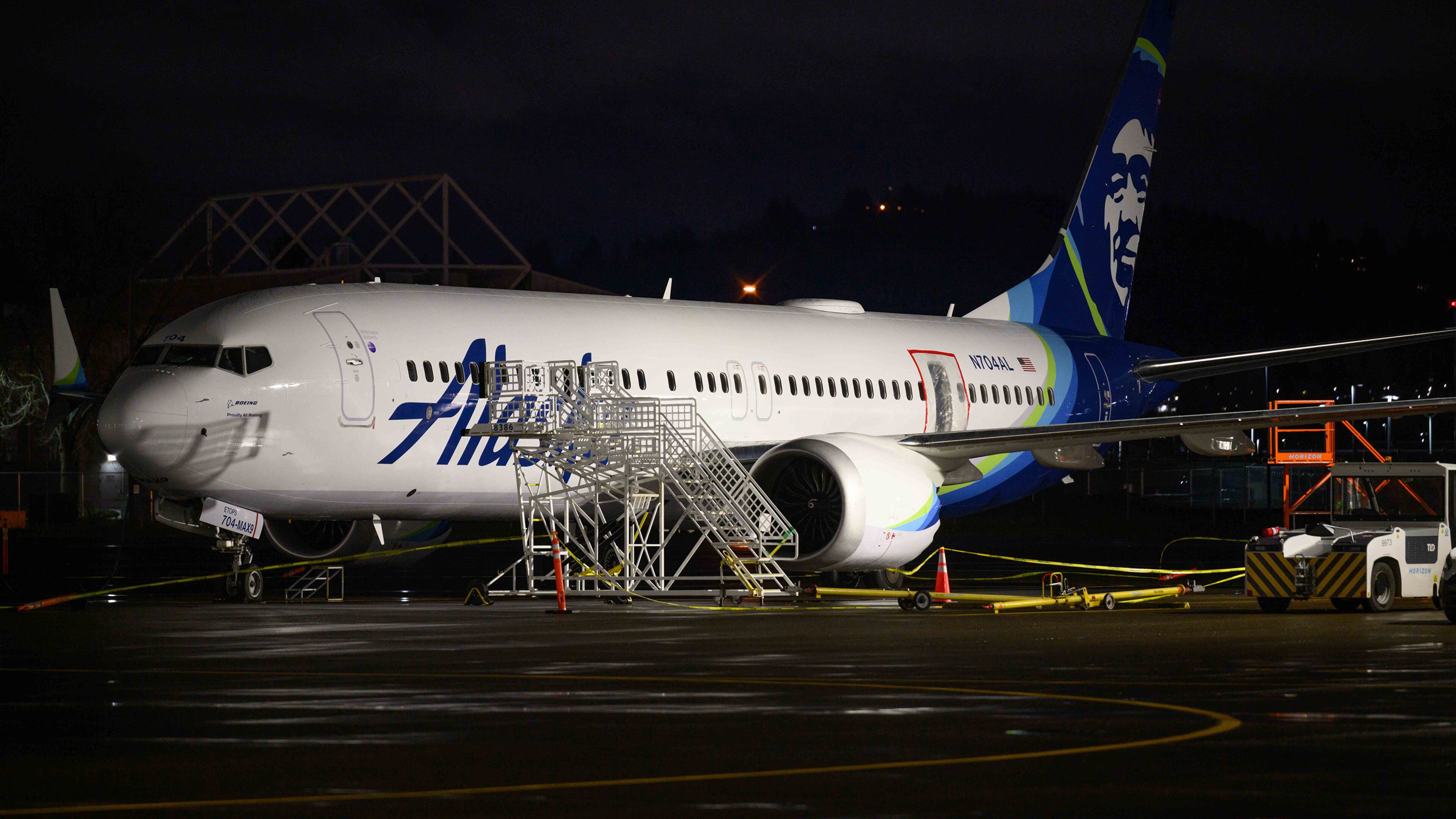 A plastic sheet covers an area of the fuselage of the Alaska Airlines N704AL Boeing 737 MAX 9 aircraft outside a hangar at Portland International Airport on Jan. 8, 2024, in Portland, Oregon, following a midair fuselage blowout on Jan. 5. None of the 171 passengers and six crew members were seriously injured. (Mathieu Lewis-Rolland/Getty Images/TNS)