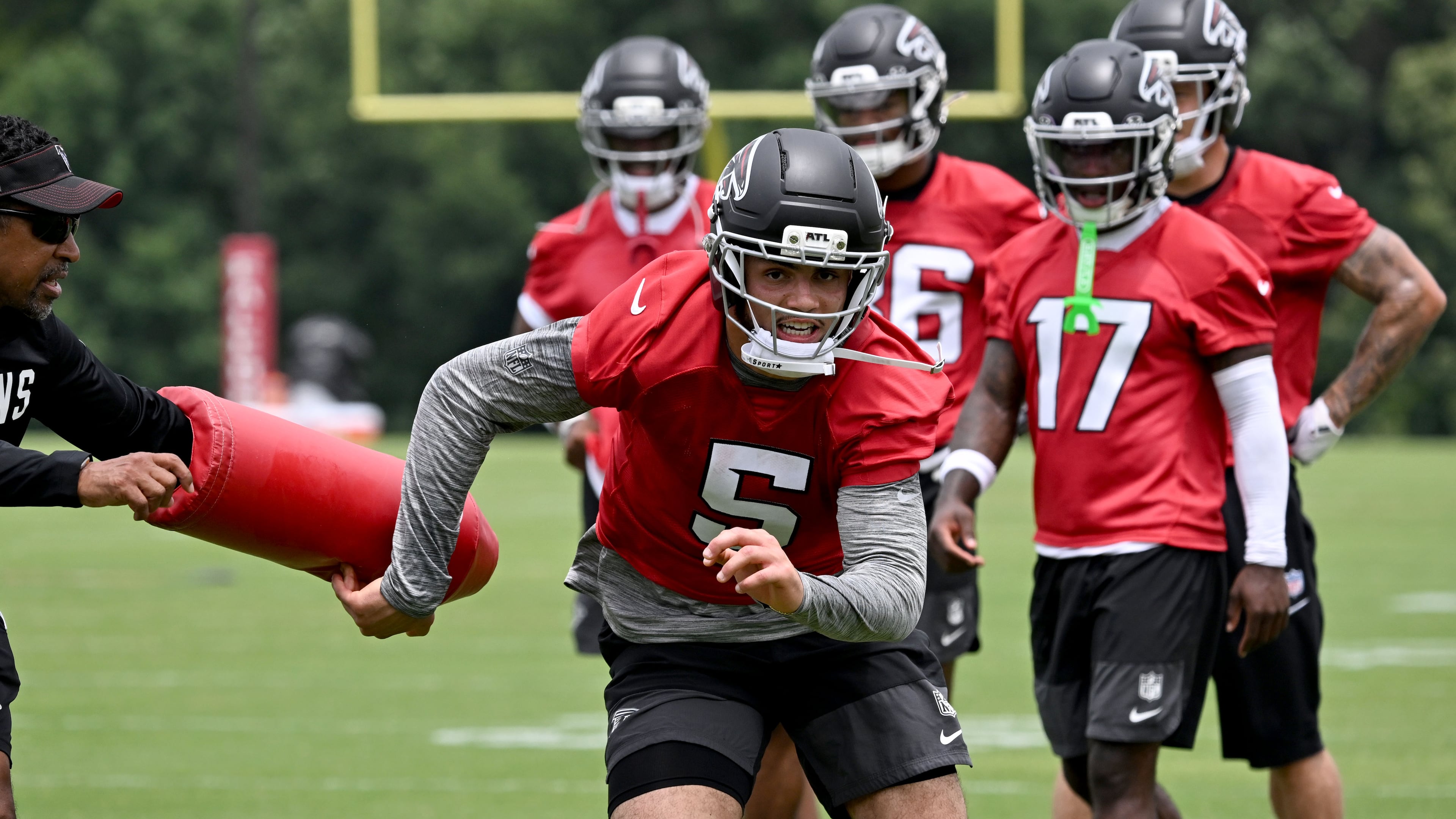 Falcons wide receiver Drake London (center) runs a drill during an OTA workout at the team's training facility Wednesday, May 27, 2026, in Flowery Branch. Atlanta finishes mandatory minicamp Wednesday and will return for training camp six weeks later. (Hyosub Shin/AJC)