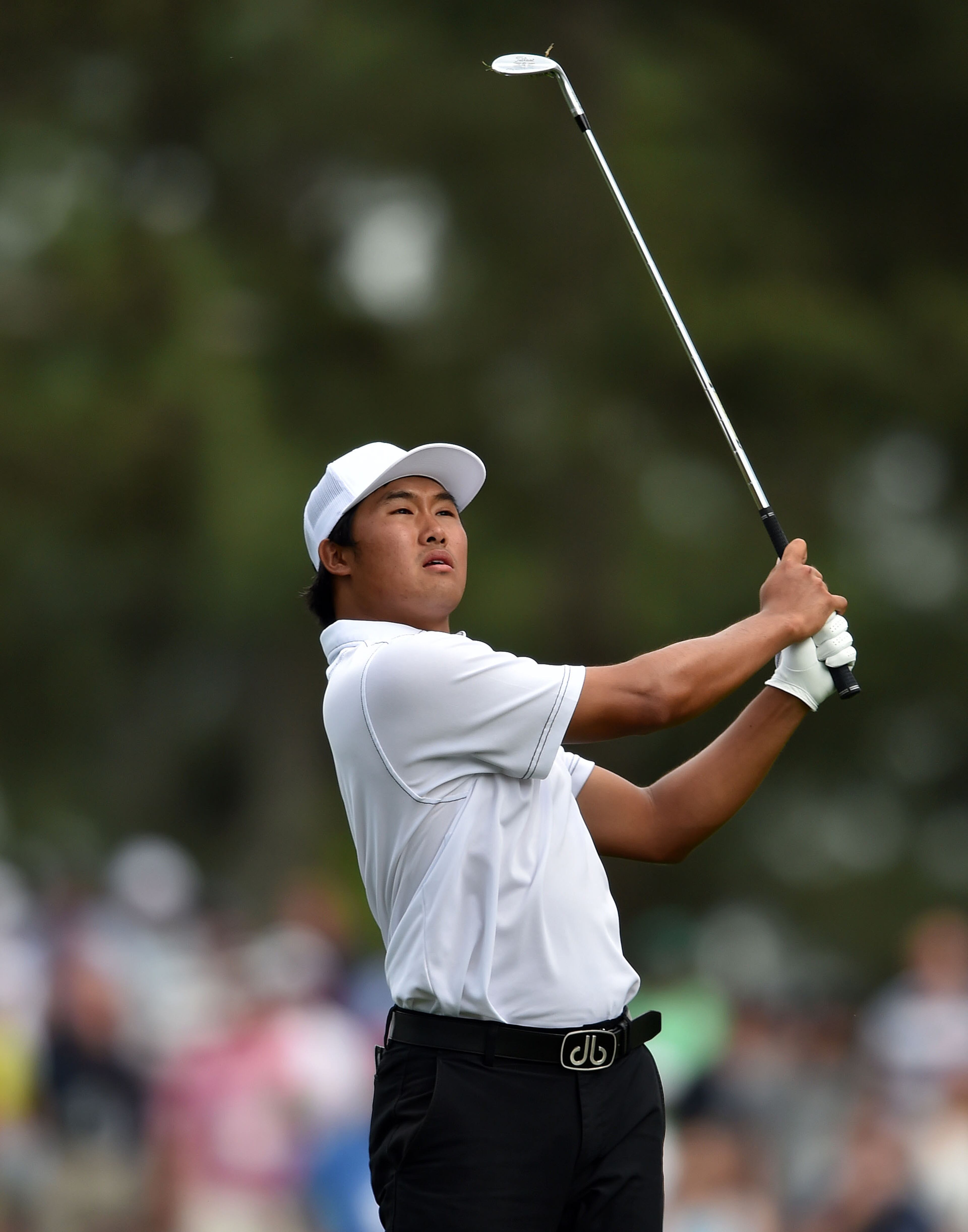Gunn Yang hits from the #15 tee at 14-over. Photos from the second round at the Masters Golf Tournament, Friday, April 10, 2015. BRANT SANDERLIN/BSANDERLIN@AJC.COM