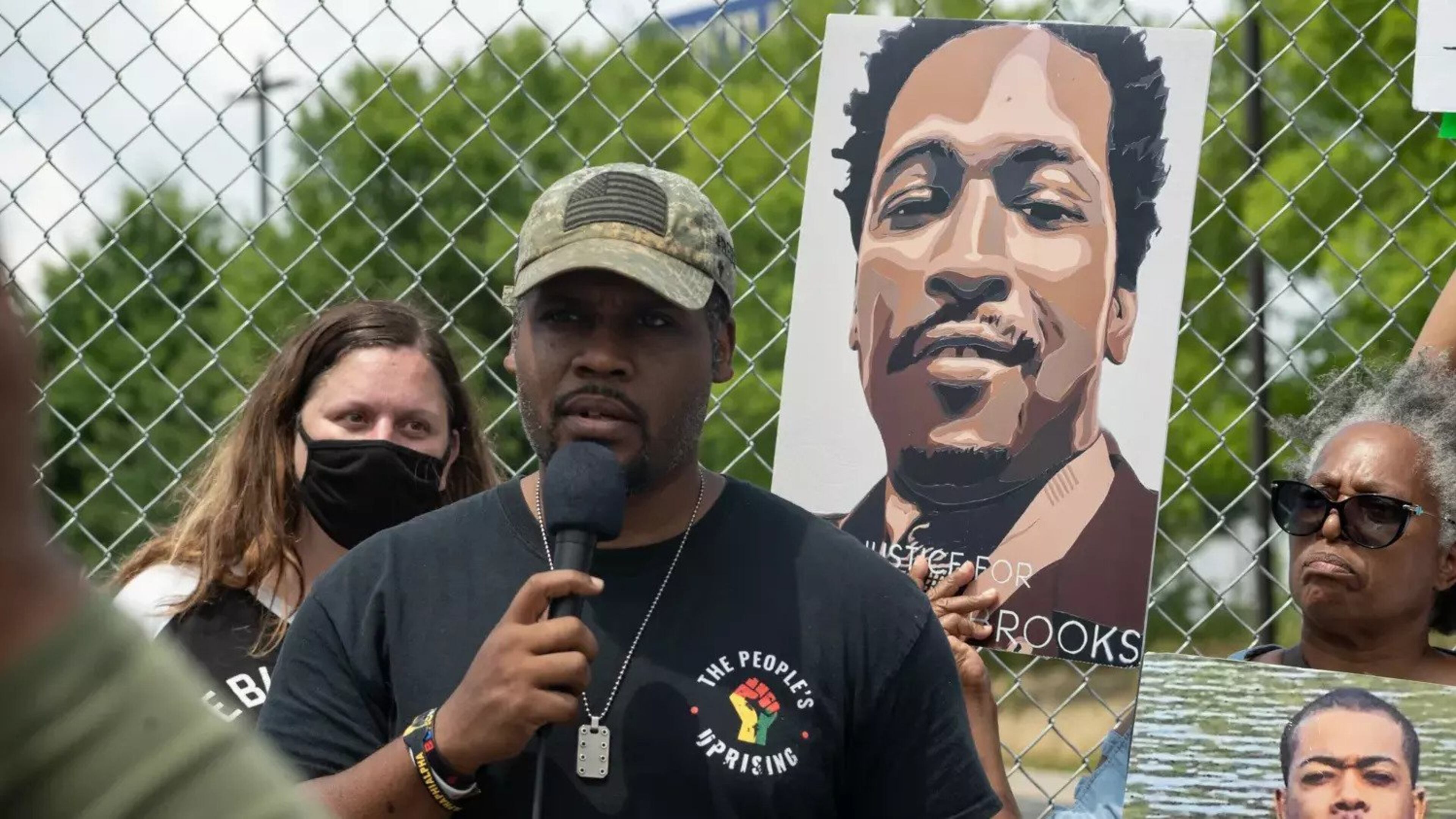 Gerald Griggs, seen in 2021 speaking to people gathered on the anniversary of the killing of Rayshard Brooks, says the NAACP will continue working to get a prosecutor to present a criminal case to a grand jury. (Photo Courtesy of Megan Varner/Getty Images)