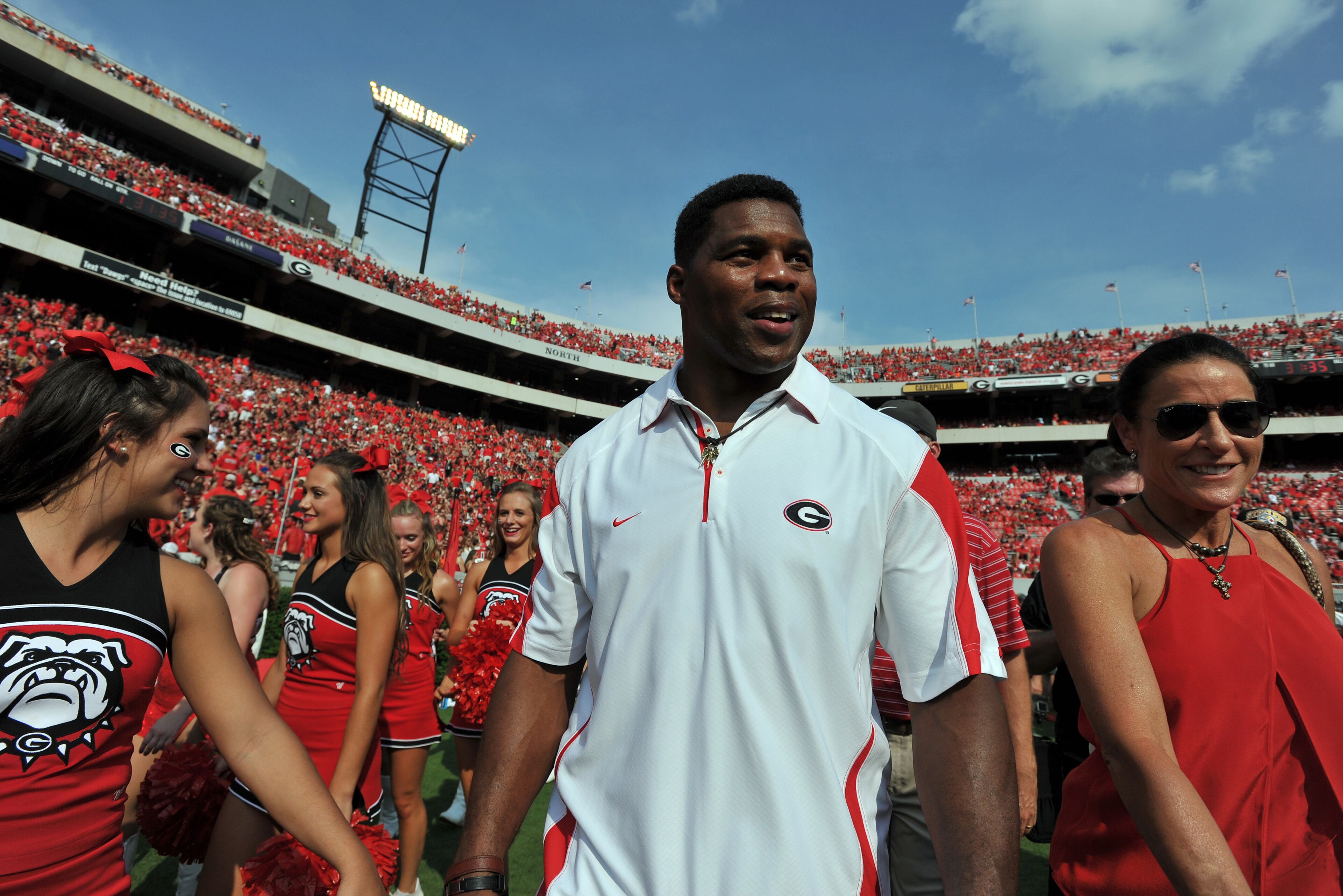 Georgia Bulldog legend Herschel Walker, walks the sidelines during pre-game warm up Saturday August 30, 2014 in Athens. Walker's nephew, Milan Richard plays for Clemson. BRANT SANDERLIN / BSANDERLIN@AJC.COM .