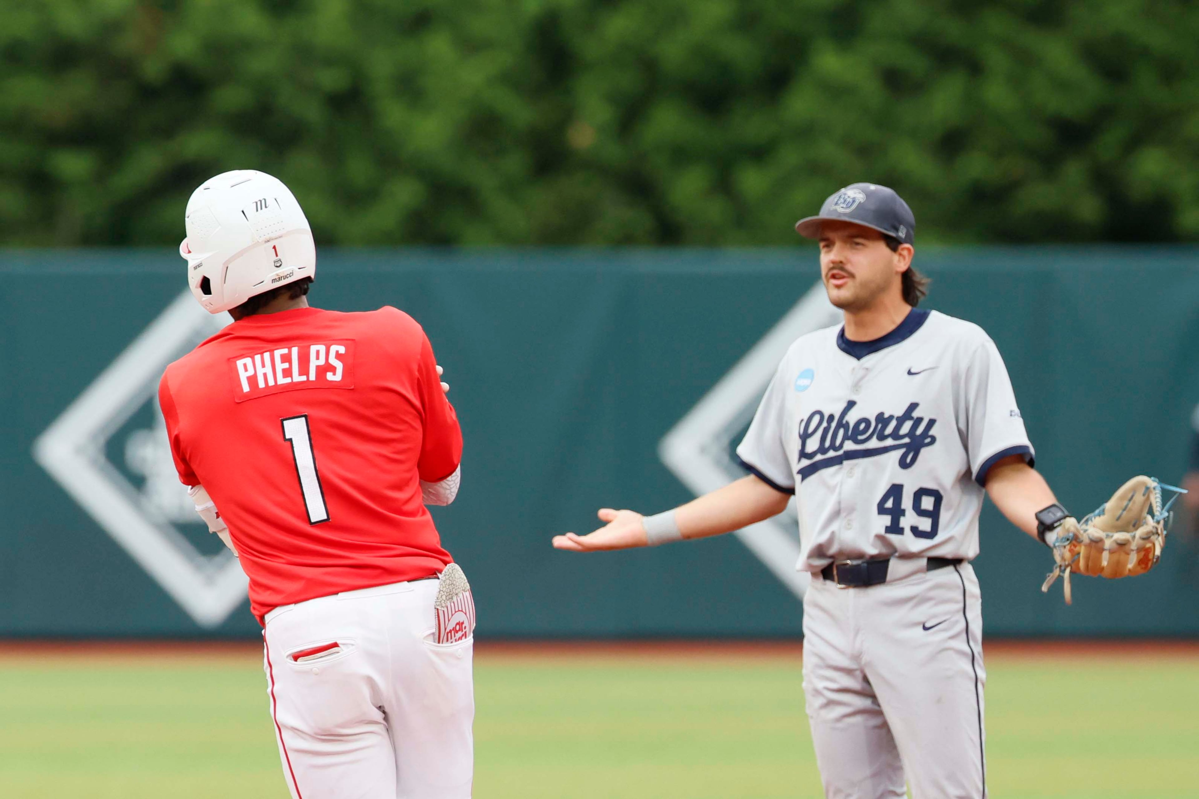 Liberty Flames infielder Easton Swofford (49) argues with Georgia Bulldogs infielder Tre Phelps (1) as he runds the bases after hitting a two-run home run during the sixth inning of their NCAA Regional final game at Foley Field on Sunday, May 31, 2026, in Athens. Tre Phelps was later ejected for excessive celebration. (Miguel Martinez/AJC)