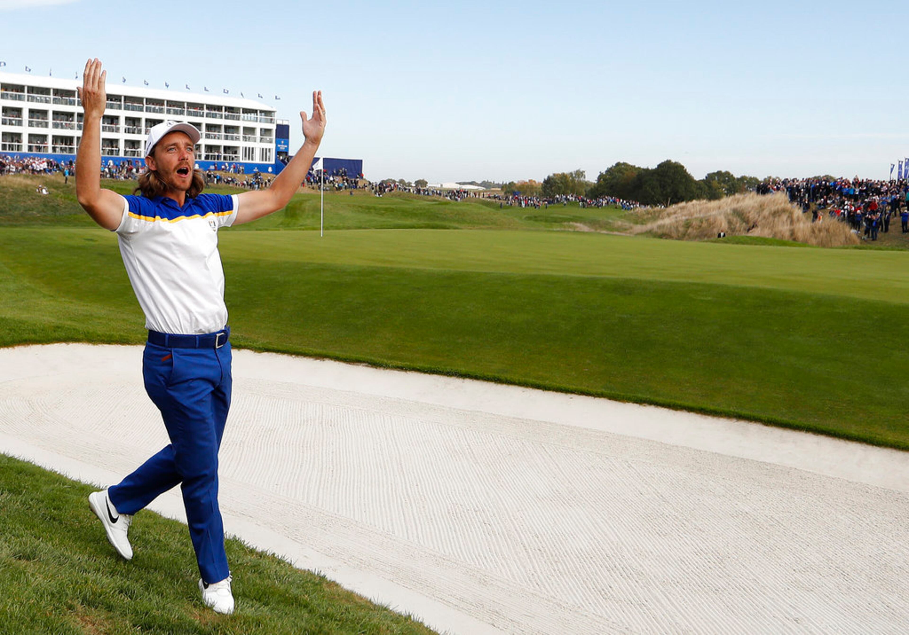 Europe's Tommy Fleetwood winds-up the crowd during the singles match on the final day of the 42nd Ryder Cup at Le Golf National in Saint-Quentin-en-Yvelines, outside Paris, France, Sunday, Sept. 30, 2018. (AP Photo/Alastair Grant)