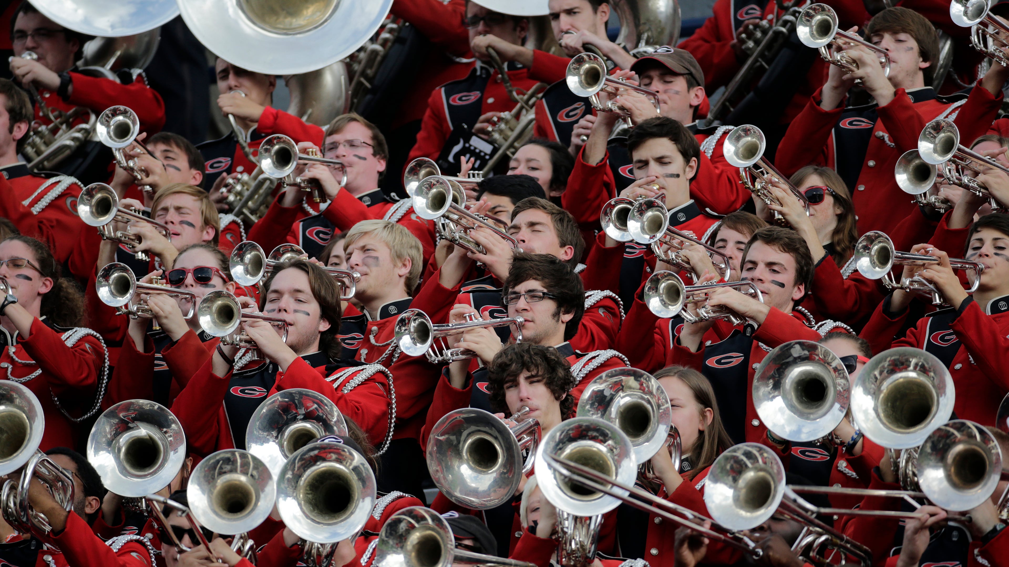 Members of the Georgia Redcoats Band performs prior to the start of a game against Auburn in Auburn, Ala.