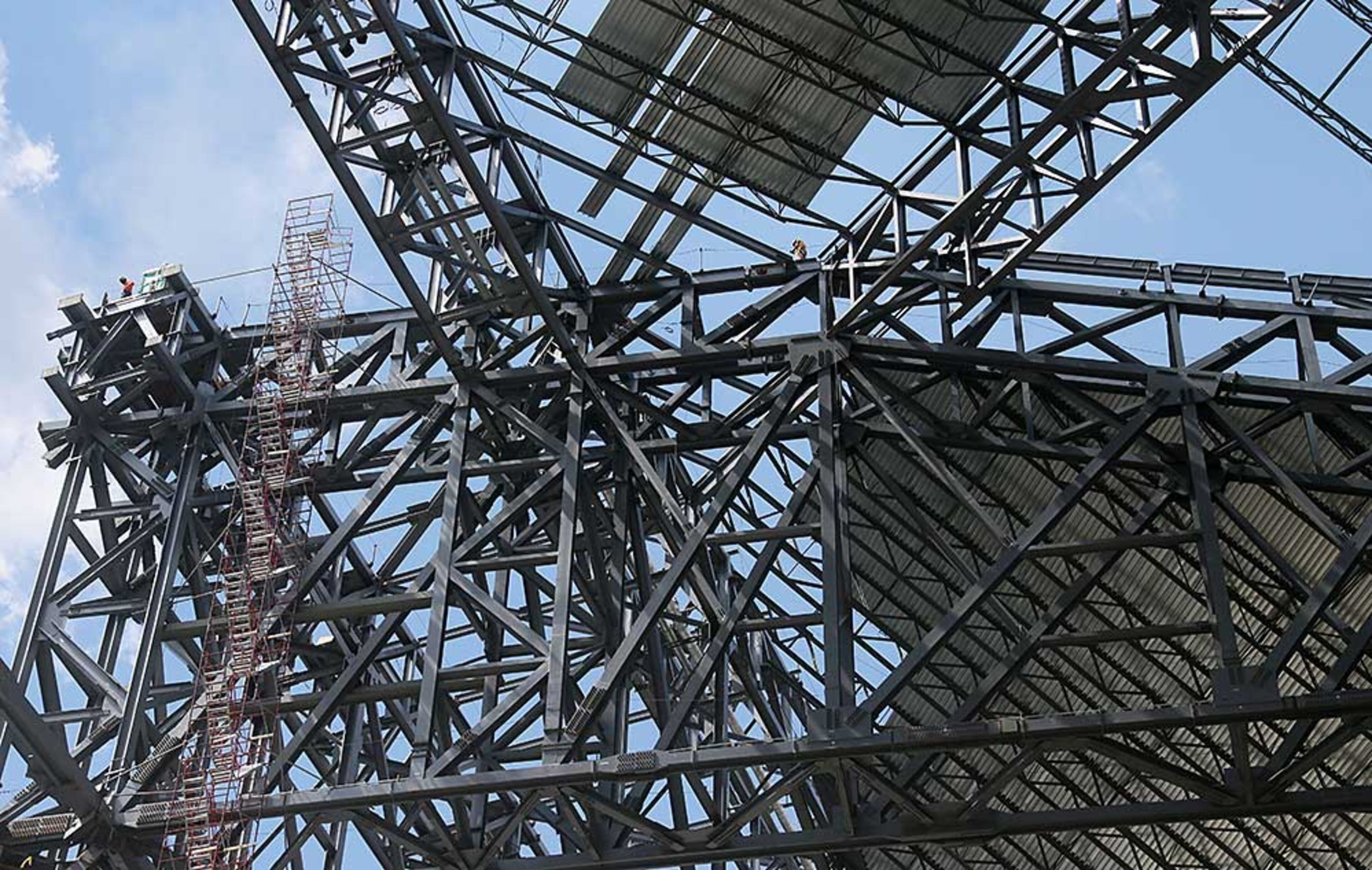 Tower and roof steel truss construction as viewed from field level in the bowl.