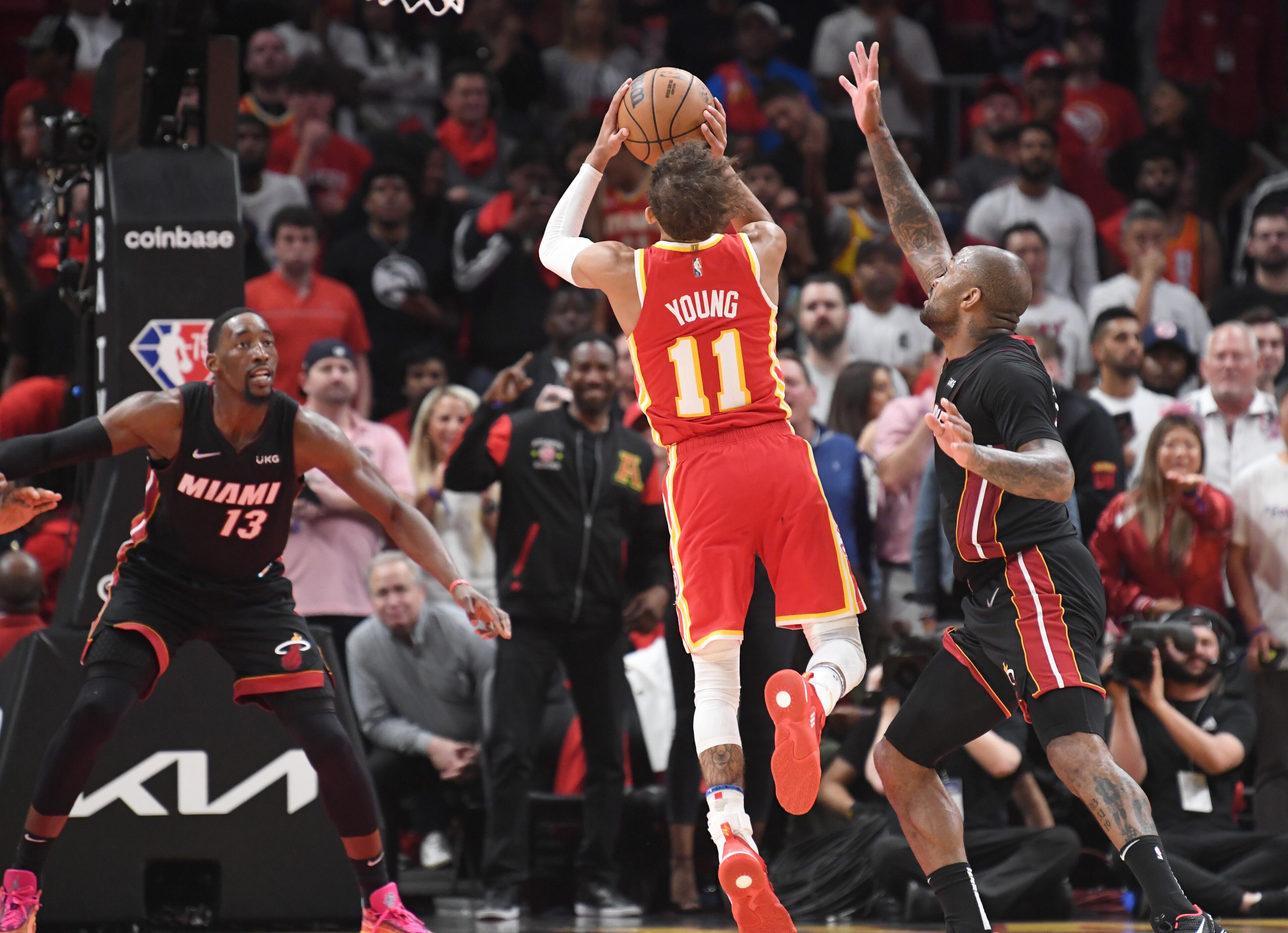 April 22, 2022 Atlanta - Atlanta Hawks' guard Trae Young (11) gets off a shot to tie game (101-101) during the second half in Game 3 of the first round of the NBA playoffs at State Farm Arena on Friday, April 22, 2022. Atlanta Hawks won 111-110 over Miami Heat. (Hyosub Shin / Hyosub.Shin@ajc.com)