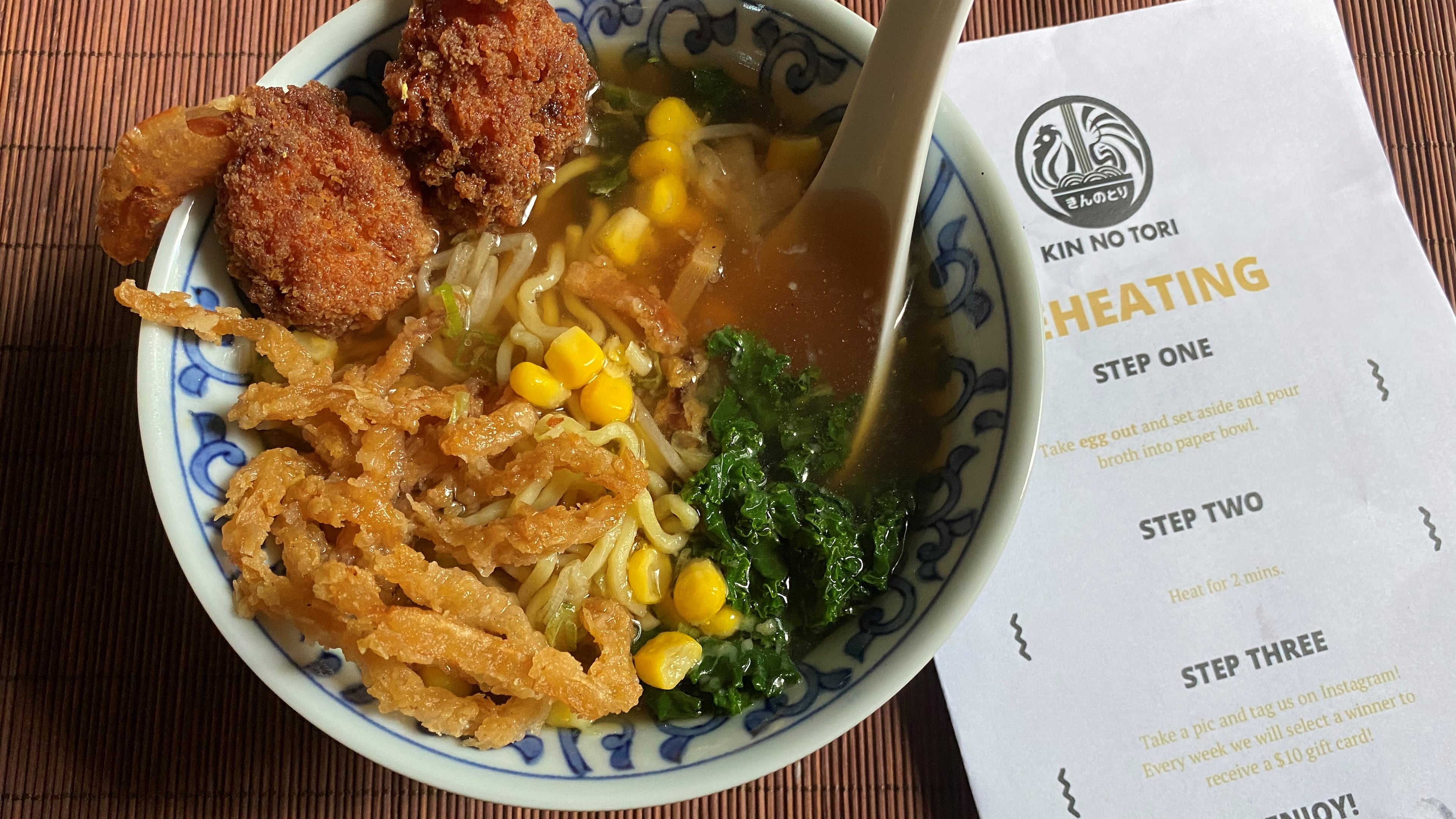 Shoyu miso ramen features vegetable broth, bean sprout, kale, bamboo shoots, fried onion, sweet corn, scallions and shrimp topping from Kin No Tori Ramen.