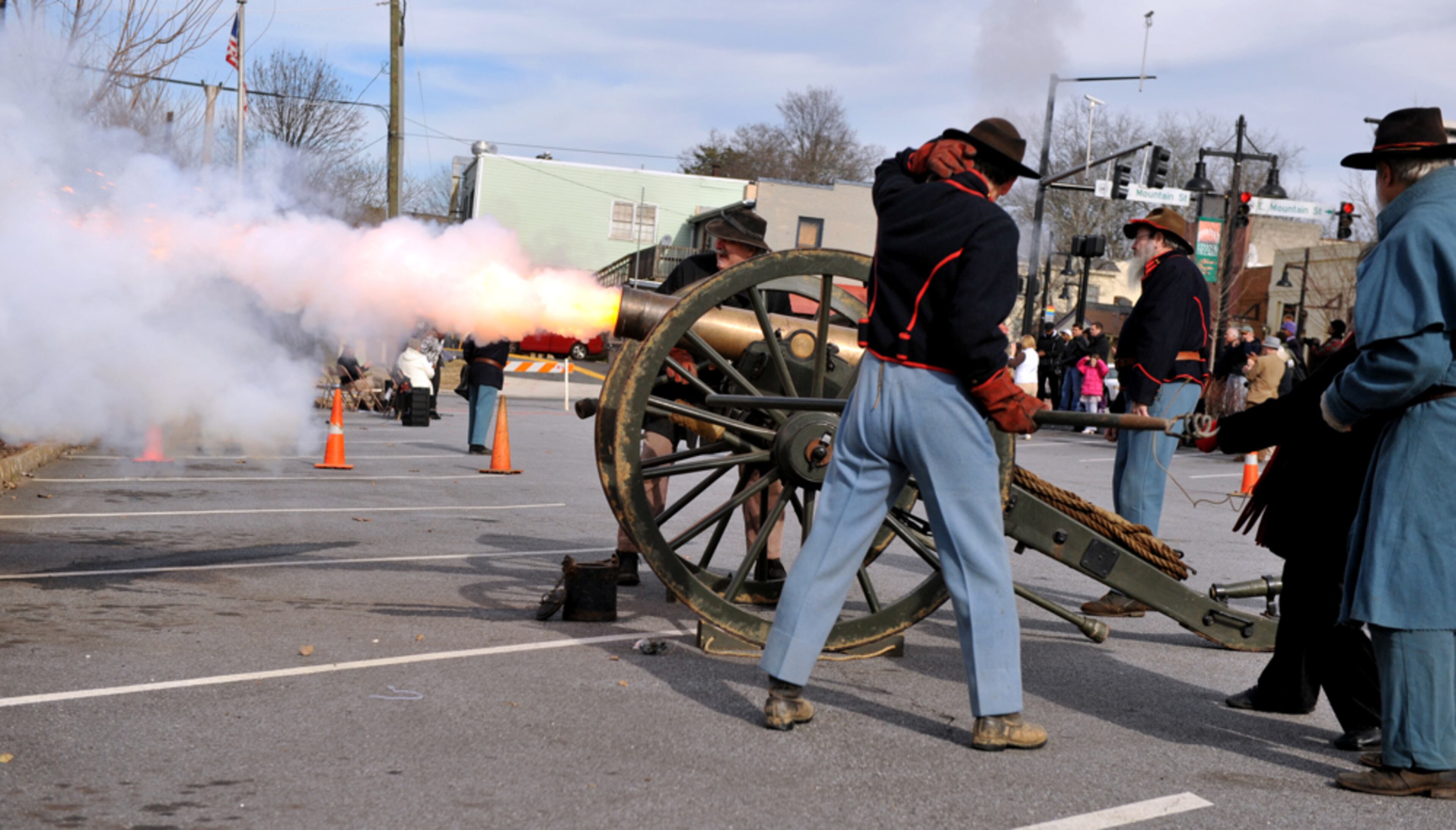 LEDE JANUARY 5, 2013 STONE MOUNTAIN A cannon shot punctuated the Stone Mountain Village's celebration in honor of the 150th anniversary of the signing of the Emancipation Proclamation in Stone Mountain Saturday, January 5, 2013. KENT D. JOHNSON / KDJOHNSON@AJC.COM I� a big history buff and also can� resist photographing whenever someone� shooting a cannon off. Getting the muzzle flash is a bonus. Made with NIKON D3, 56mm, f/4.5, 1/3200 sec, 640 ISO.