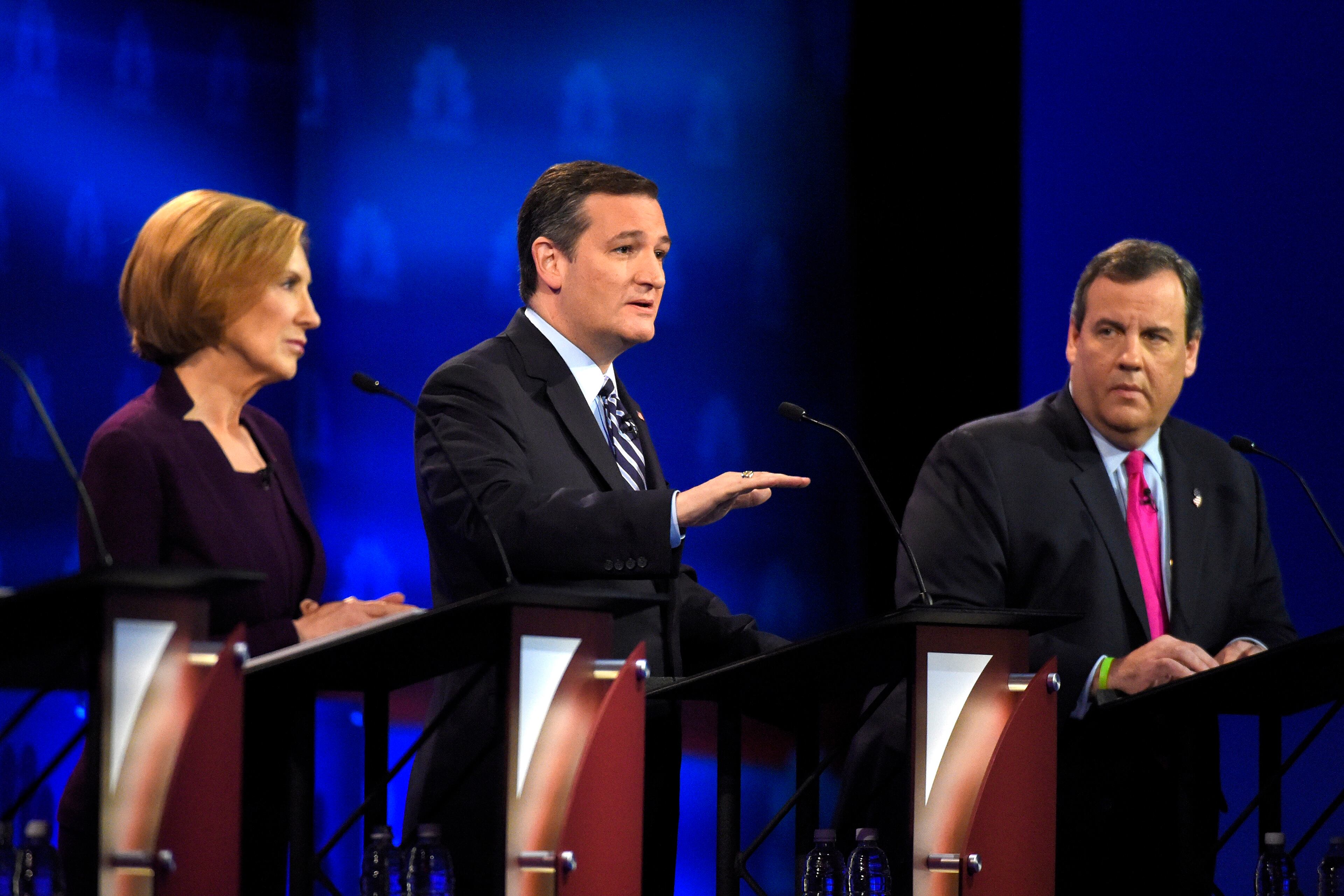 Ted Cruz, center, speaks as Carly Fiorina, left, and Chris Christie listen during the CNBC Republican presidential debate at the University of Colorado, Wednesday, Oct. 28, 2015, in Boulder, Colo. (AP Photo/Mark J. Terrill)
