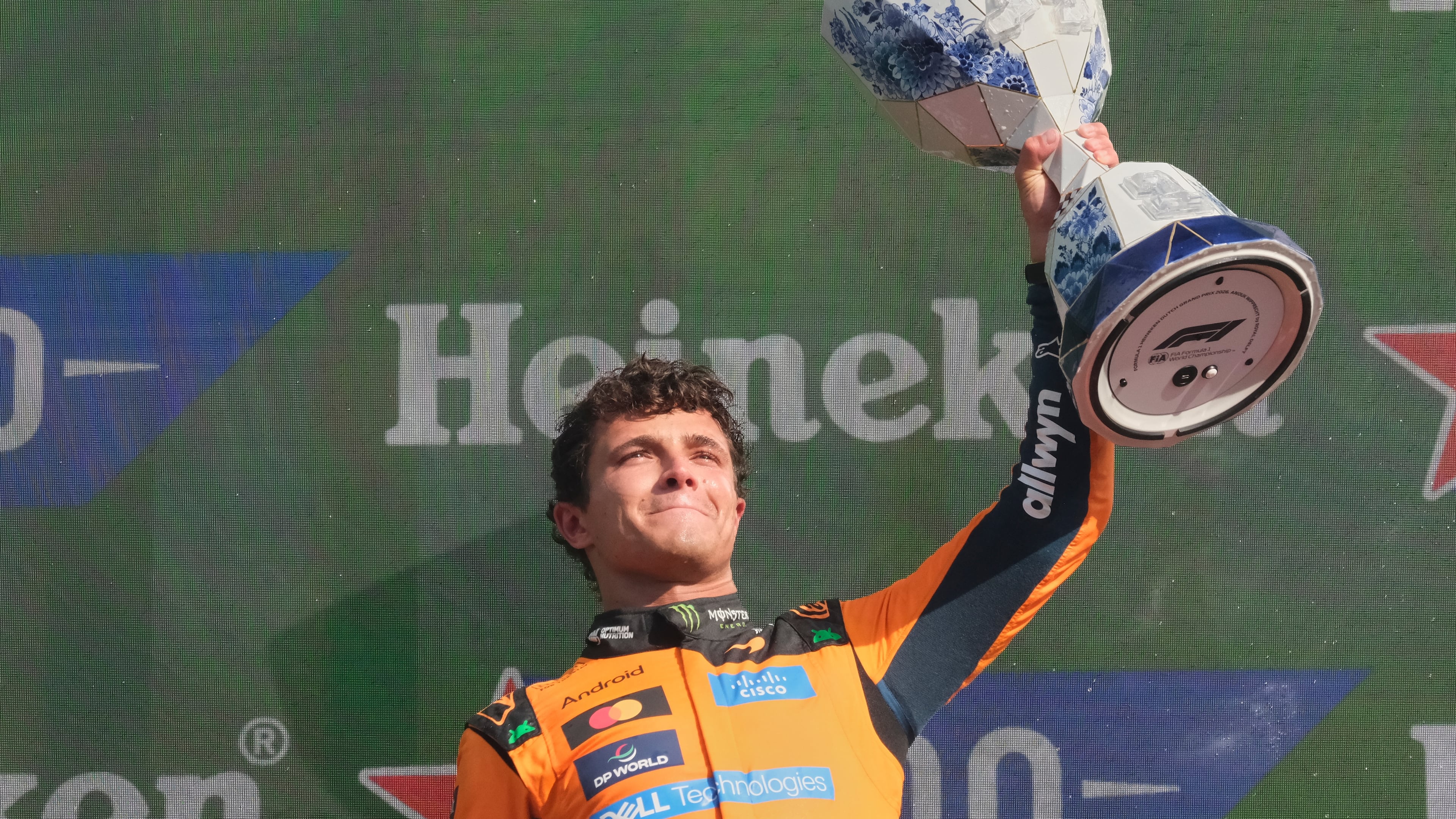 McLaren driver Lando Norris of Britain holds the trophy after winning the Formula One Dutch Grand Prix in Zandvoort , Netherlands, Sunday, Aug. 23, 2026. (AP Photo/Patrick Post)