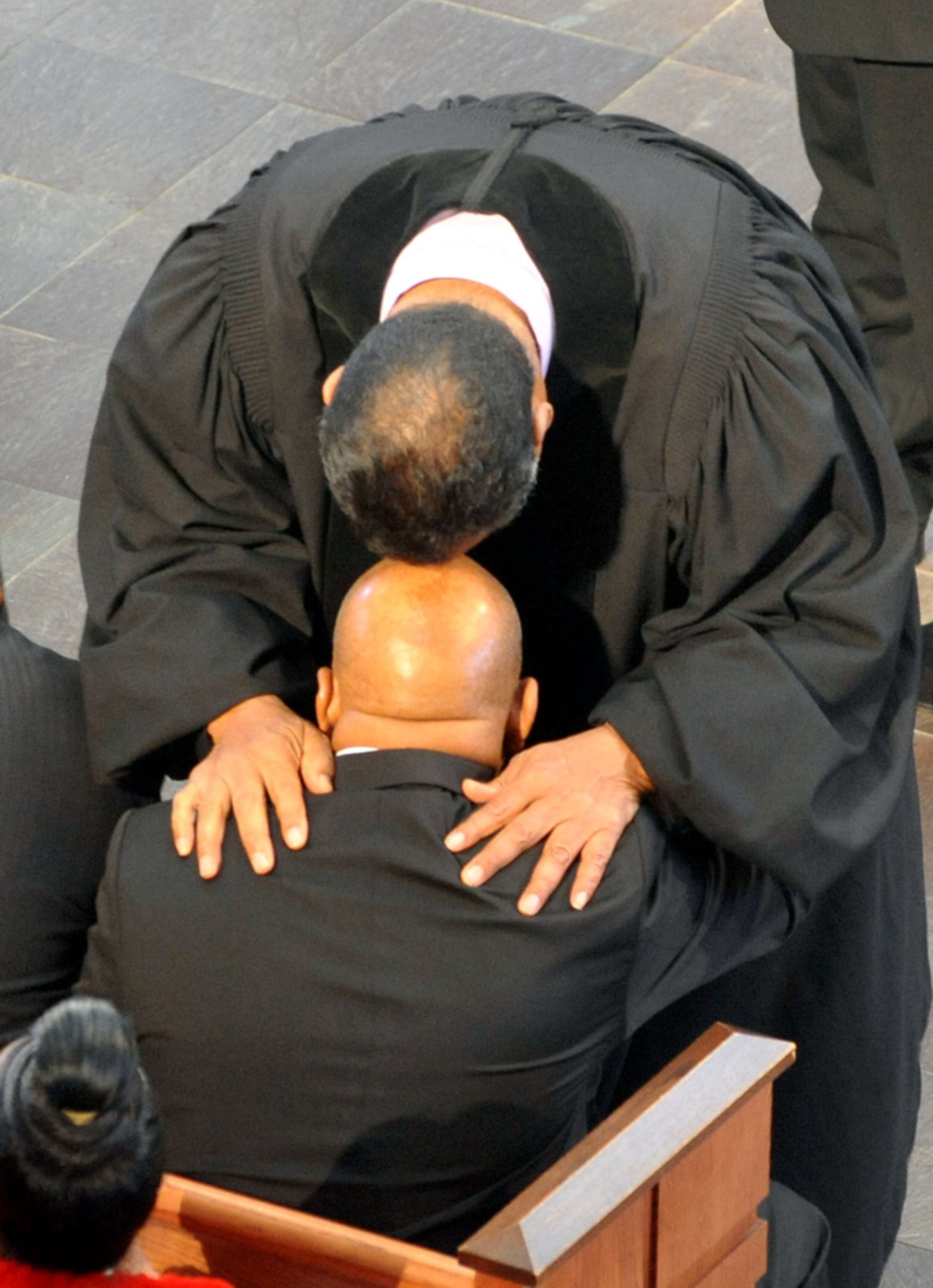 JANUARY 7, 2013 ATLANTA Rev Jesse Jackson Sr shares a moment with Congressman Lewis during the recessional. The services for Mrs. Lillian Miles Lewis, wife of U.S. Rep. John Lewis, were held at Ebenezer Baptist Church Monday January 7, 2013. Rep. Lewis and his wife were married there 44 years ago. Reverend Jesse Jackson, former Ambassador Andrew Young, Xernona Clayton Brady, Christine King Farris and Anita Hill were among those giving remarks and remembrances. Singer Jennifer Holliday performed "The Last Mile of the Way." Reverend Raphael Warnock, Pastor of Ebenezer Baptist Church, gave the eulogy. KENT D. JOHNSON / KDJOHNSON@AJC.COM I�e been honored to cover some of the Civil Rights era's most notable personalities. I wanted to show how these are normal folks that were put into extraordinary circumstances. When Rev Jackson leaned down to comfort Rep Lewis, I knew I had the moment. Made with NIKON D3, 200mm, f/5.6, 1/80 sec, 3200 ISO.