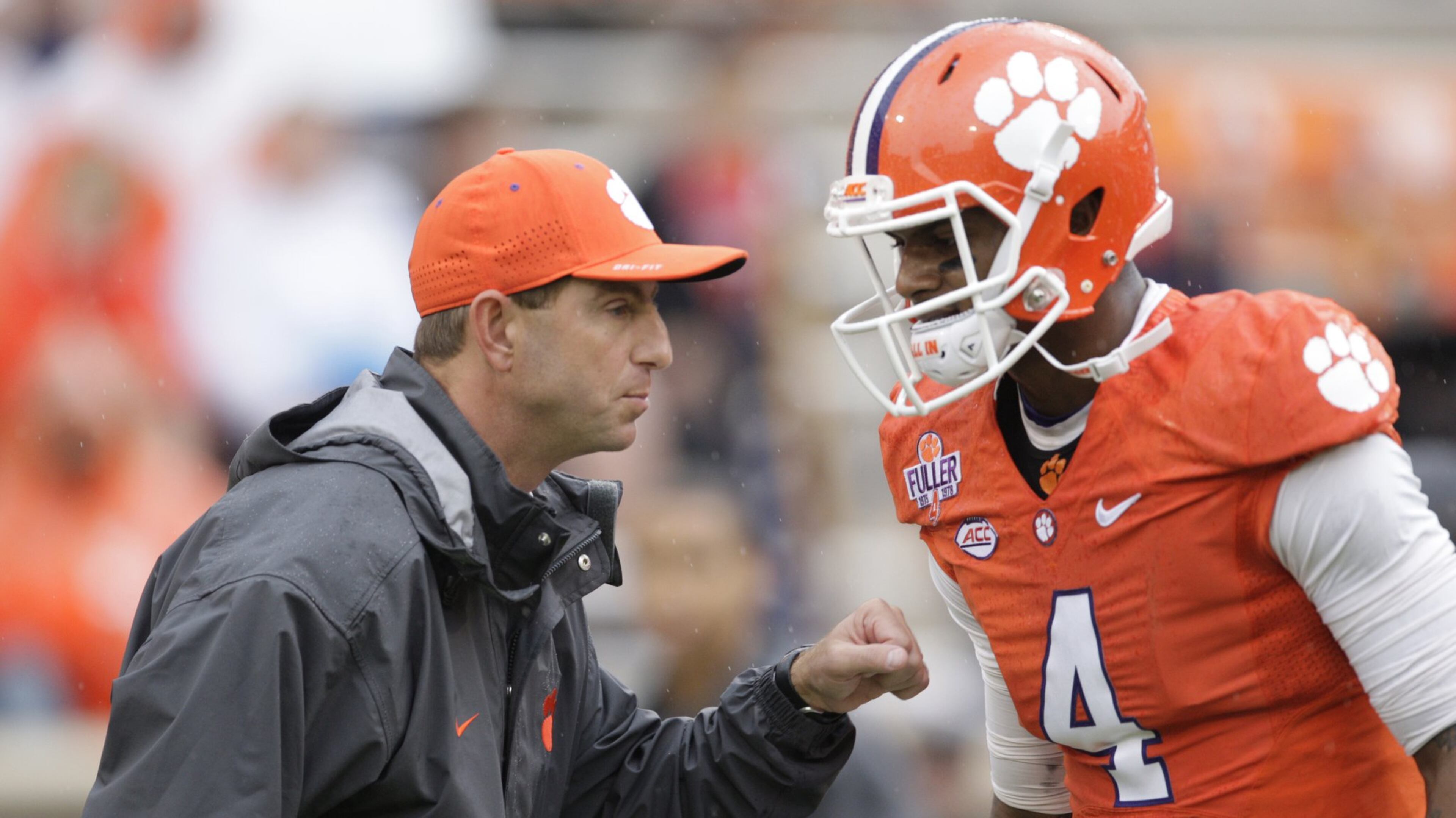 Coach Dabo Swinney of Clemson talks with quarterback Deshaun Watson just before their game against Georgia Tech on Saturday. (Photo by Tyler Smith/Getty Images)