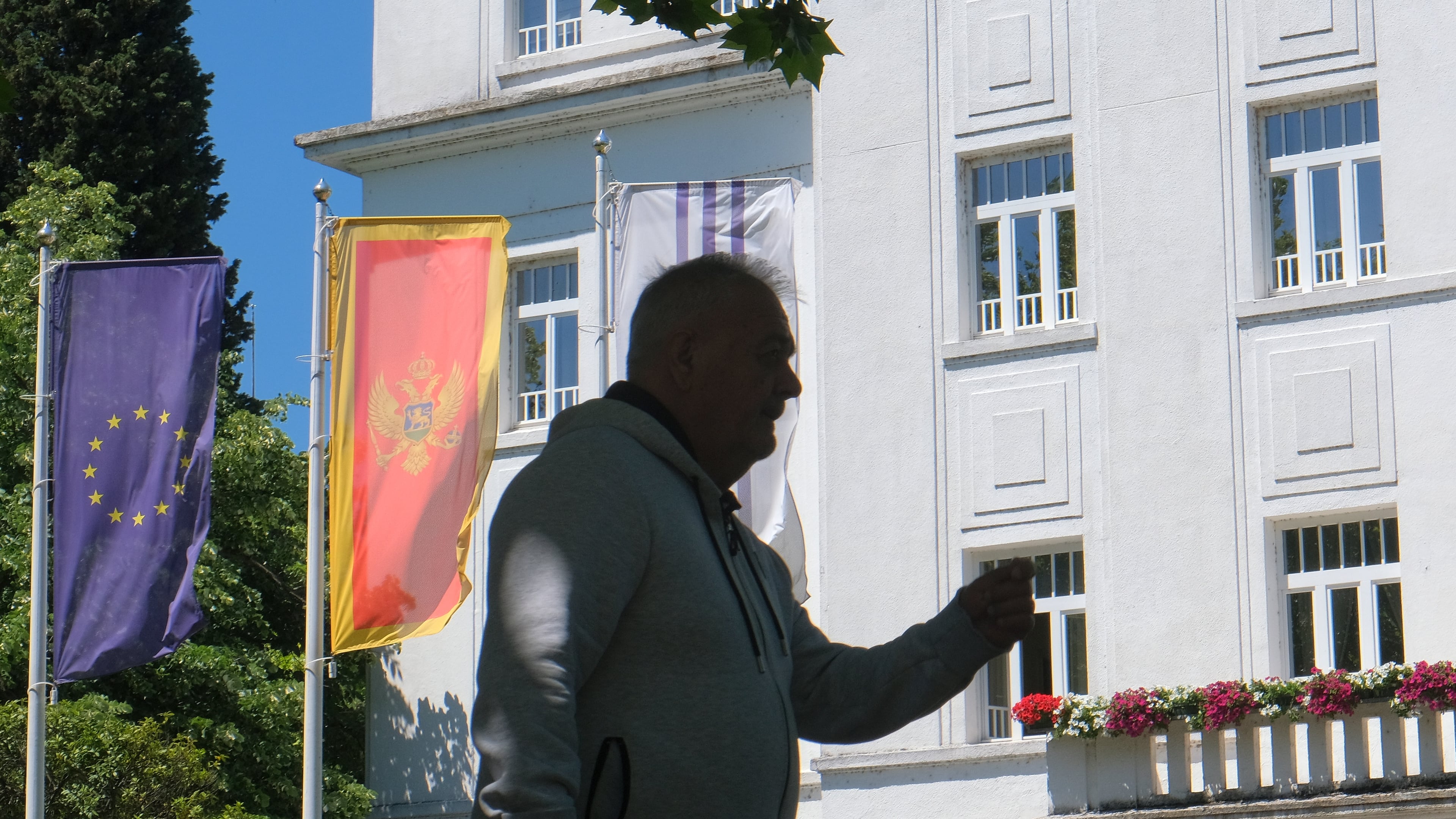 A man walks on a street in Montenegro's capital Podgorica, Monday, May 18, 2026. (AP Photo/Risto Bozovic)