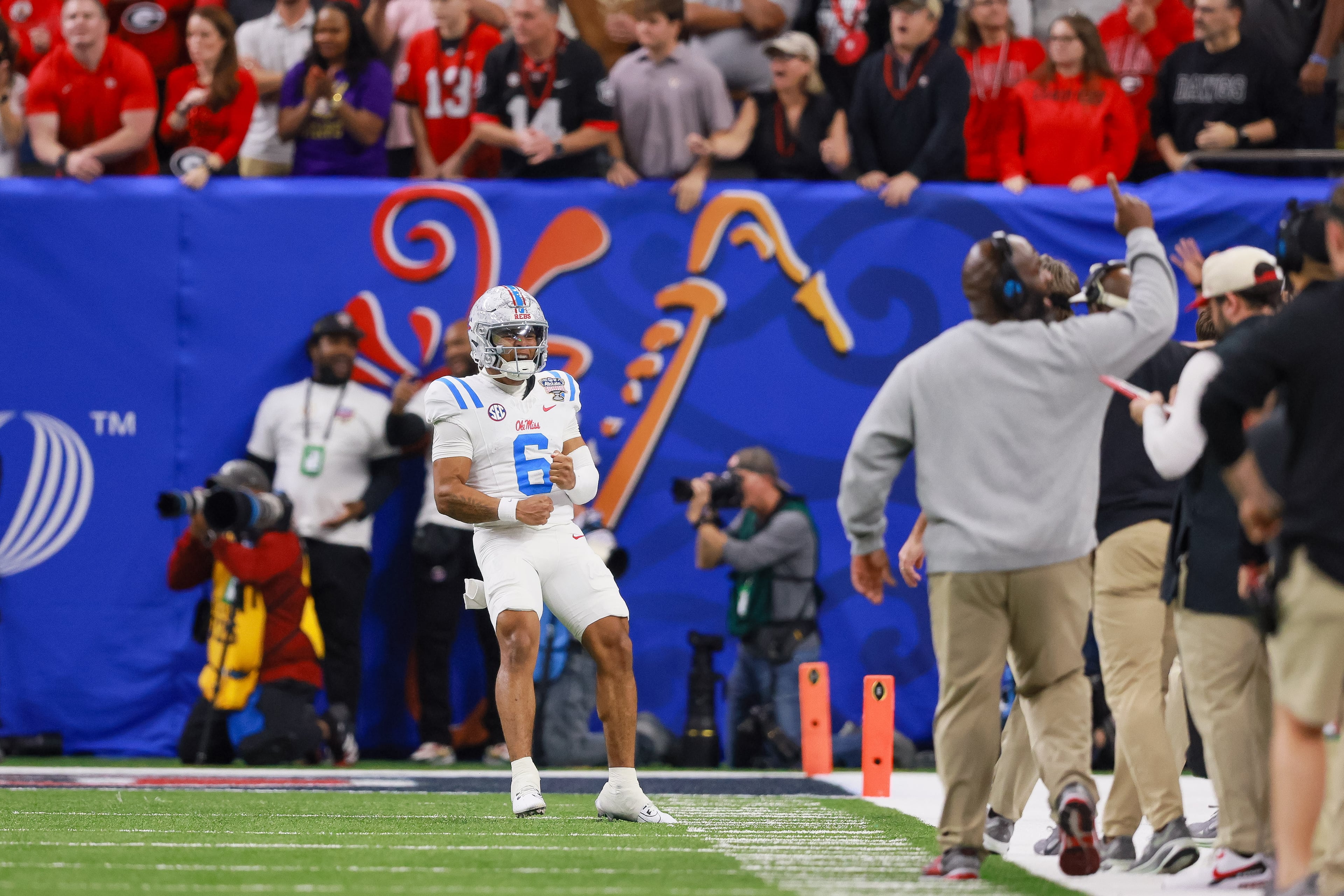 Ole Miss Rebels quarterback Trinidad Chambliss (6) reacts after throwing a touchdown against the Georgia Bulldogs during the second quarter of the College Football Playoff quarterfinal game at the Sugar Bowl in the Caesars Superdome, Thursday, Jan. 1, 2026, in New Orleans. (Jason Getz/AJC)