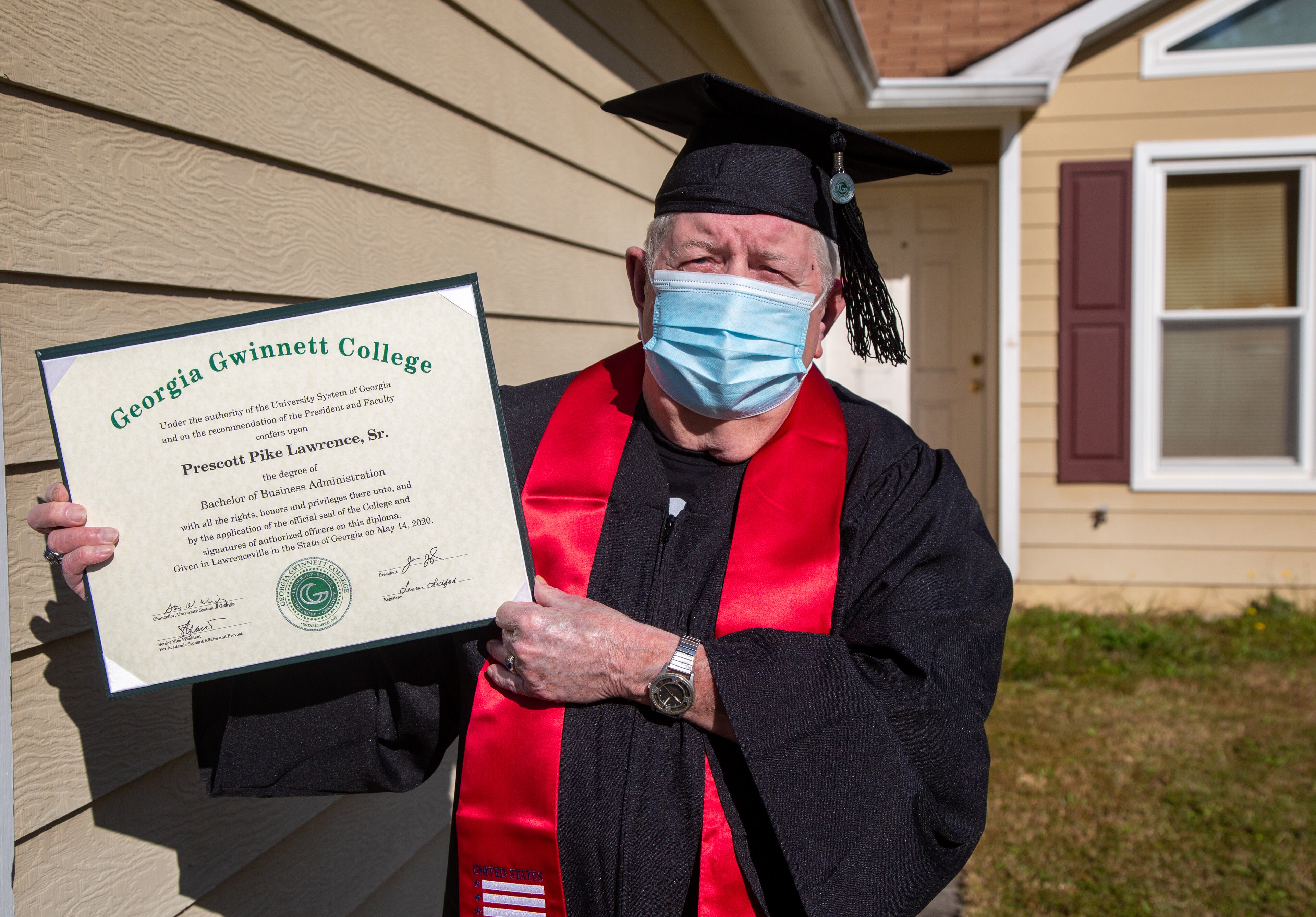 Portrait of 82-year-old Prescott Lawrence in his graduation cap & gown at his home in Grayson, Ga. He recently graduated from Georgia Gwinnett College with a degree he never plans to use. He believes the key to life is feeding the mind and caring for the body. PHIL SKINNER FOR THE ATLANTA JOURNAL-CONSTITUTION.