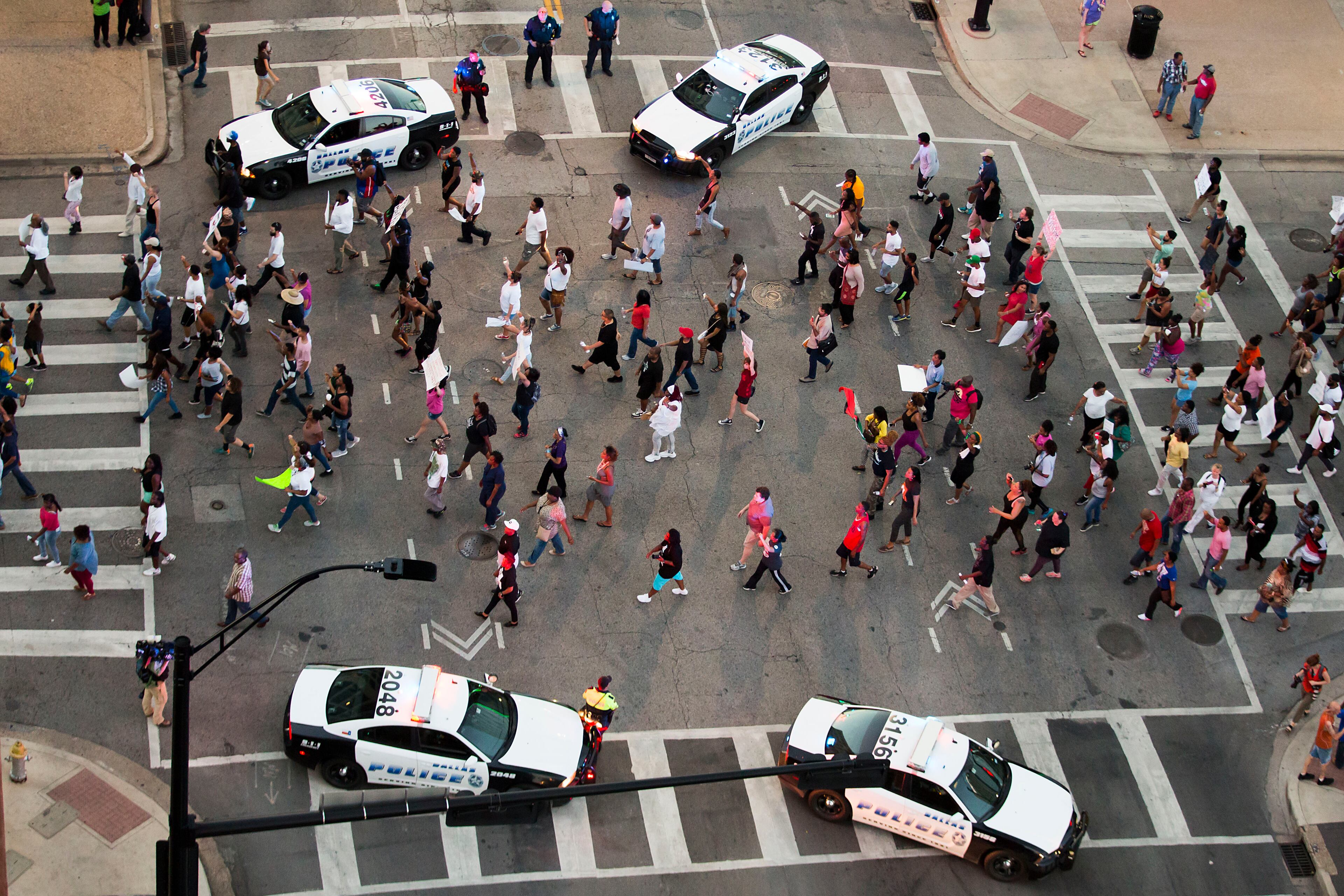 Protesters march during a Black Live Matter rally in downtown Dallas on Thursday, July 7, 2016. Multiple media outlets report that shots were fired later Thursday during the protest over two recent fatal police shootings of black men. (Smiley N. Pool/The Dallas Morning News via AP)