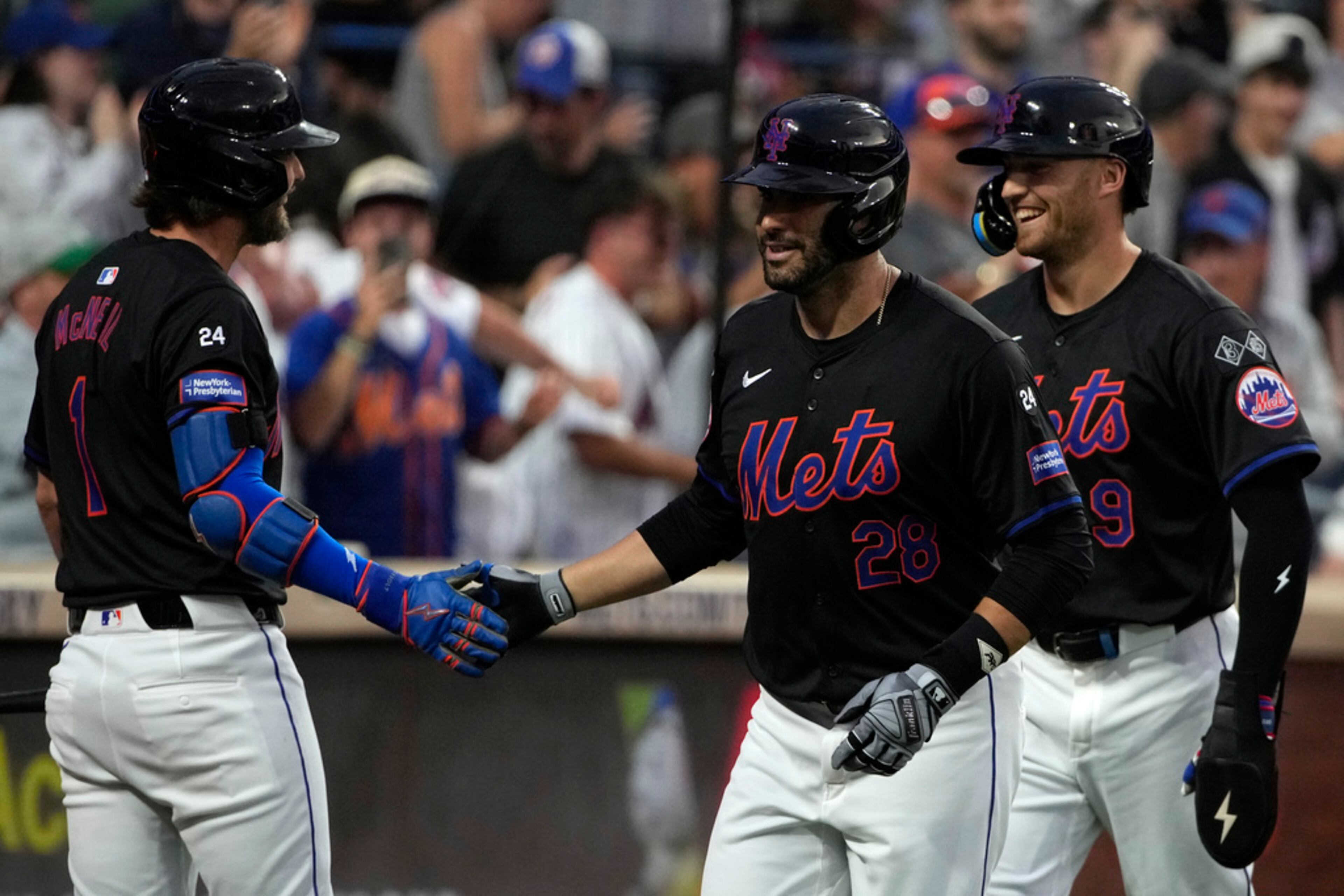 New York Mets' Jeff McNeil, left, J.D. Martinez, center, and Brandon Nimmo, right, celebrate after Martinez hit a grand slam. (AP Photo/Pamela Smith)