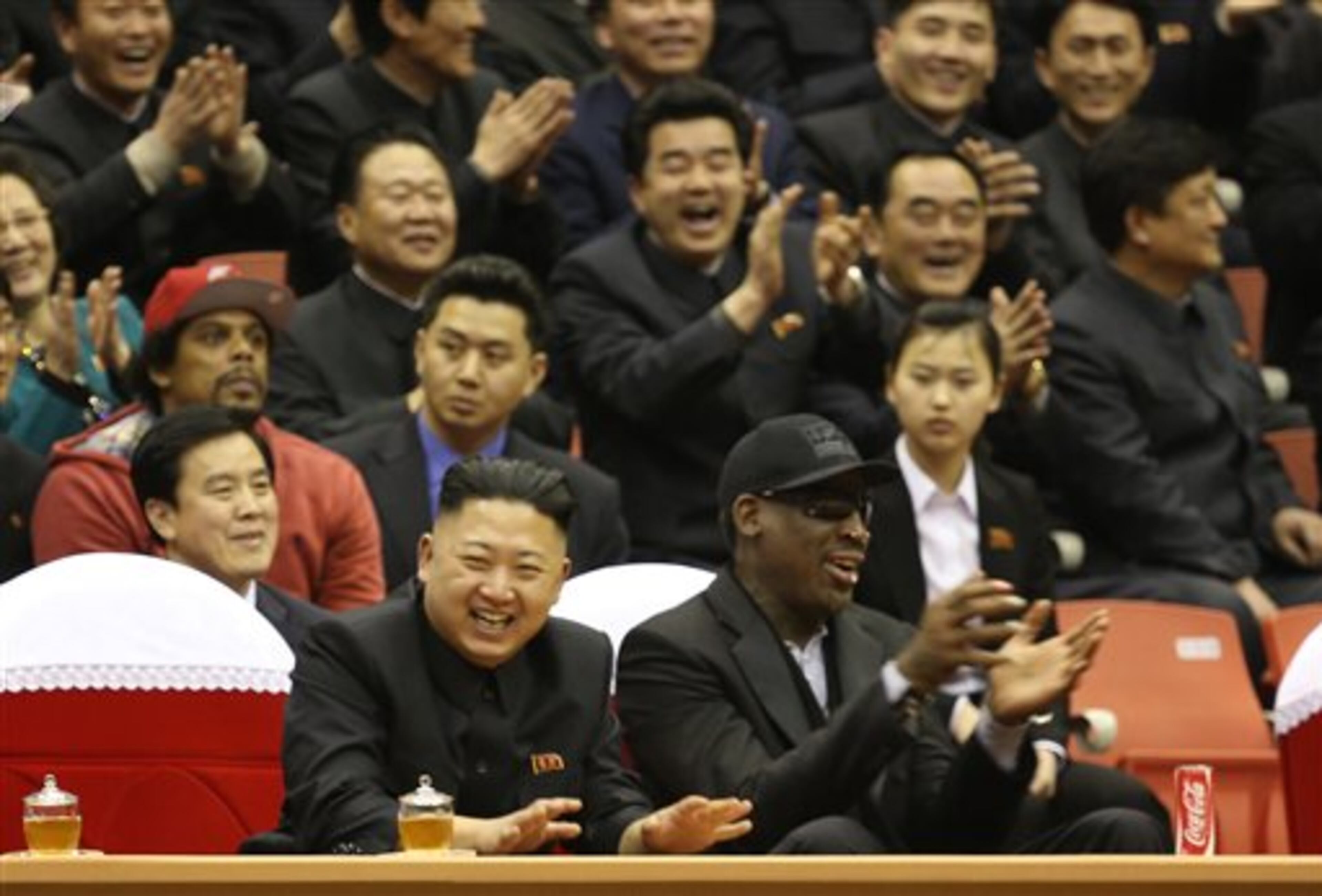 North Korean leader Kim Jong Un, left, and former NBA star Dennis Rodman watch North Korean and U.S. players in an exhibition basketball game at an arena in Pyongyang, North Korea, Thursday, Feb. 28, 2013. Rodman arrived in Pyongyang on Monday with three members of the Harlem Globetrotters basketball team to shoot an episode on North Korea for a new weekly HBO series. (AP Photo/VICE Media, Jason Mojica)