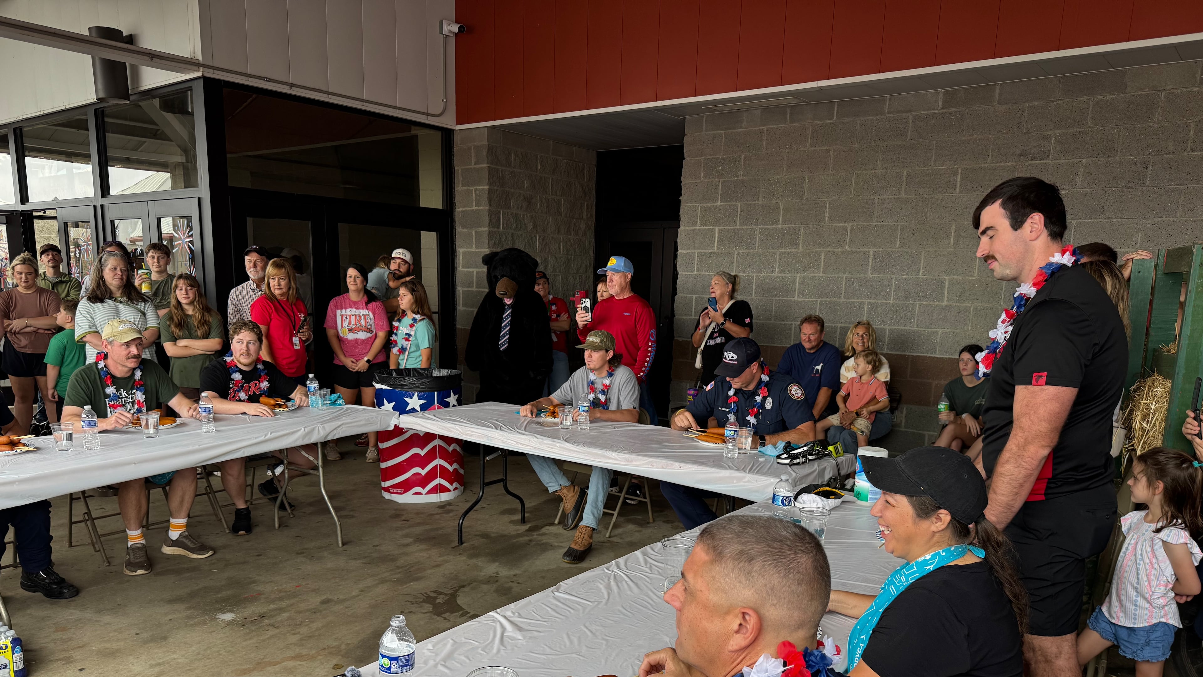 “When the music starts, you start eating,” announcer Anya Turpin told participants in the corn dog eating contest at the Georgia National Fair. “When the music stops, you stop.” (Caleb Groves/ AJC)
