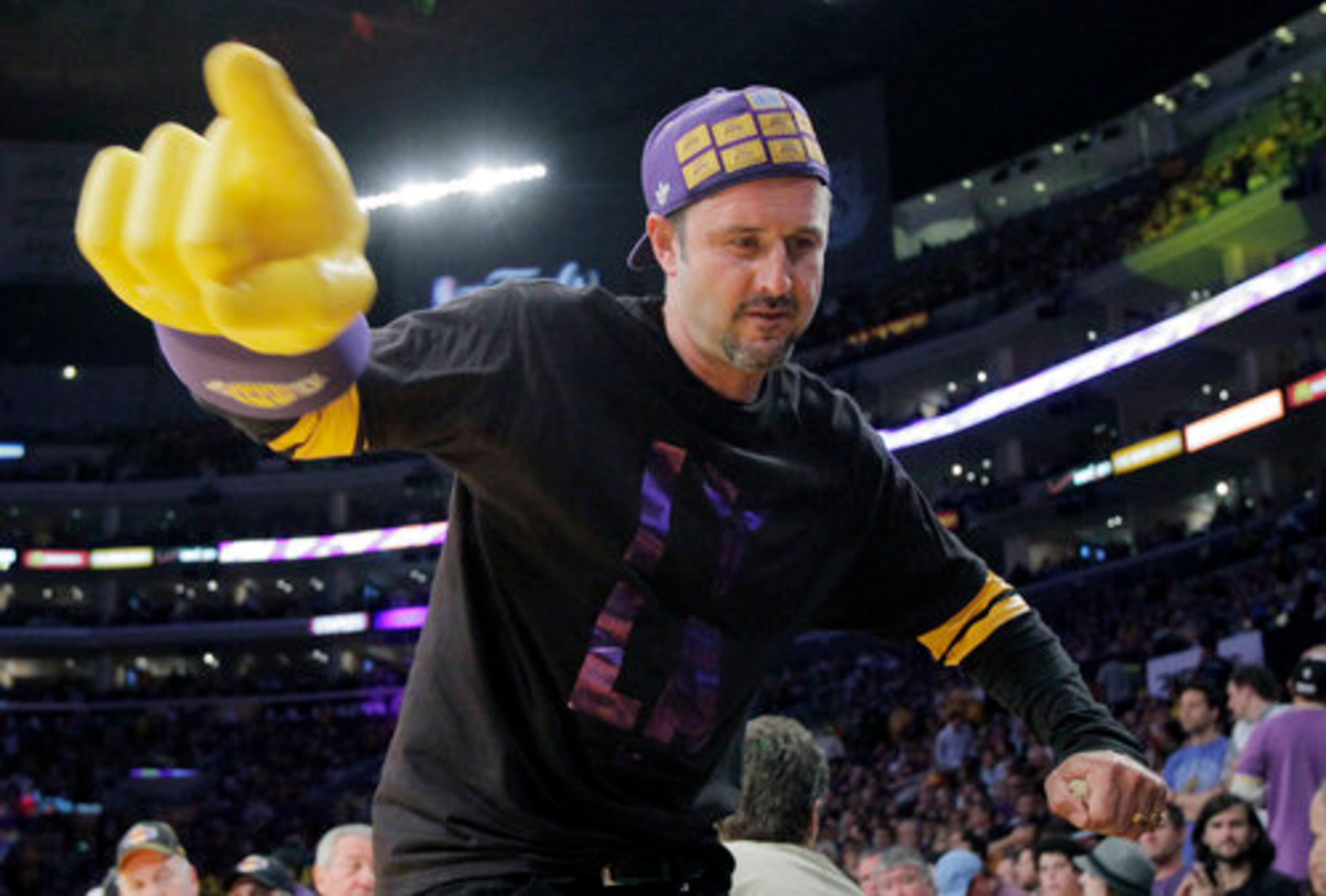 THIS IS WHAT SUPER MARIO LOOKS LIKE WHEN HE BUSTS A MOVE: David Arquette dances during a timeout in the second half of Game 7 of the NBA Finals in Los Angeles.