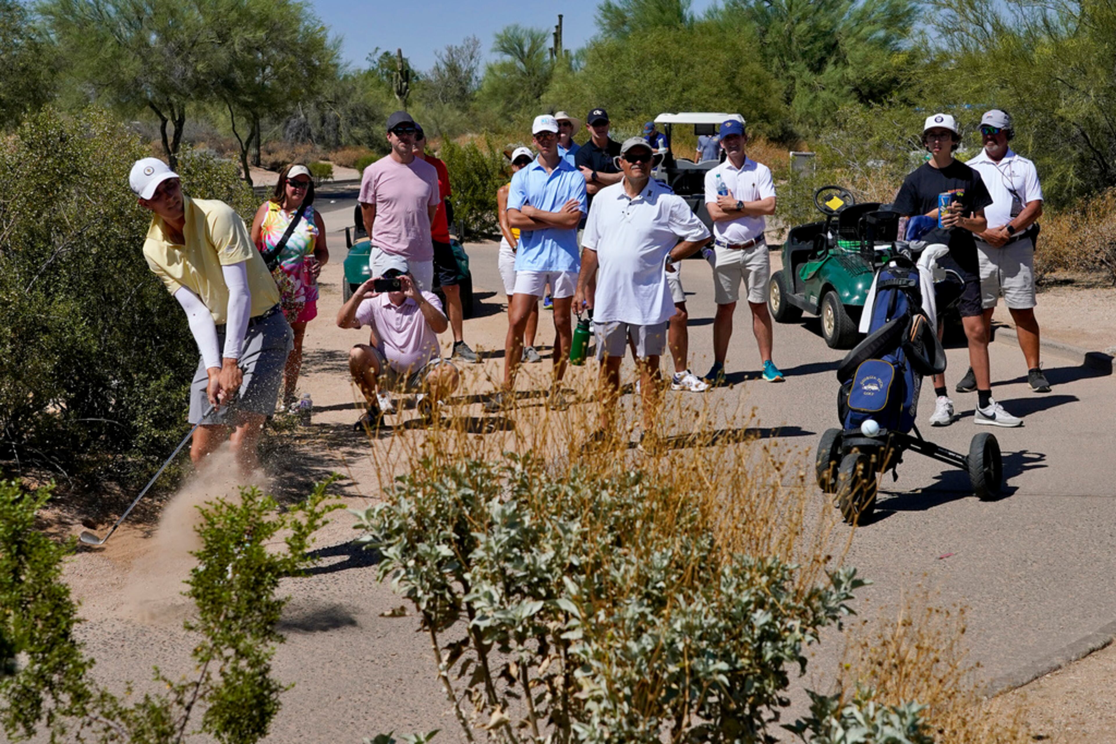 Georgia Tech golfer Ross Steelman hits from the cart path along the third green during the final round of the NCAA college men's match play golf championship, Wednesday, May 31, 2023, in Scottsdale, Ariz. (AP Photo/Matt York)