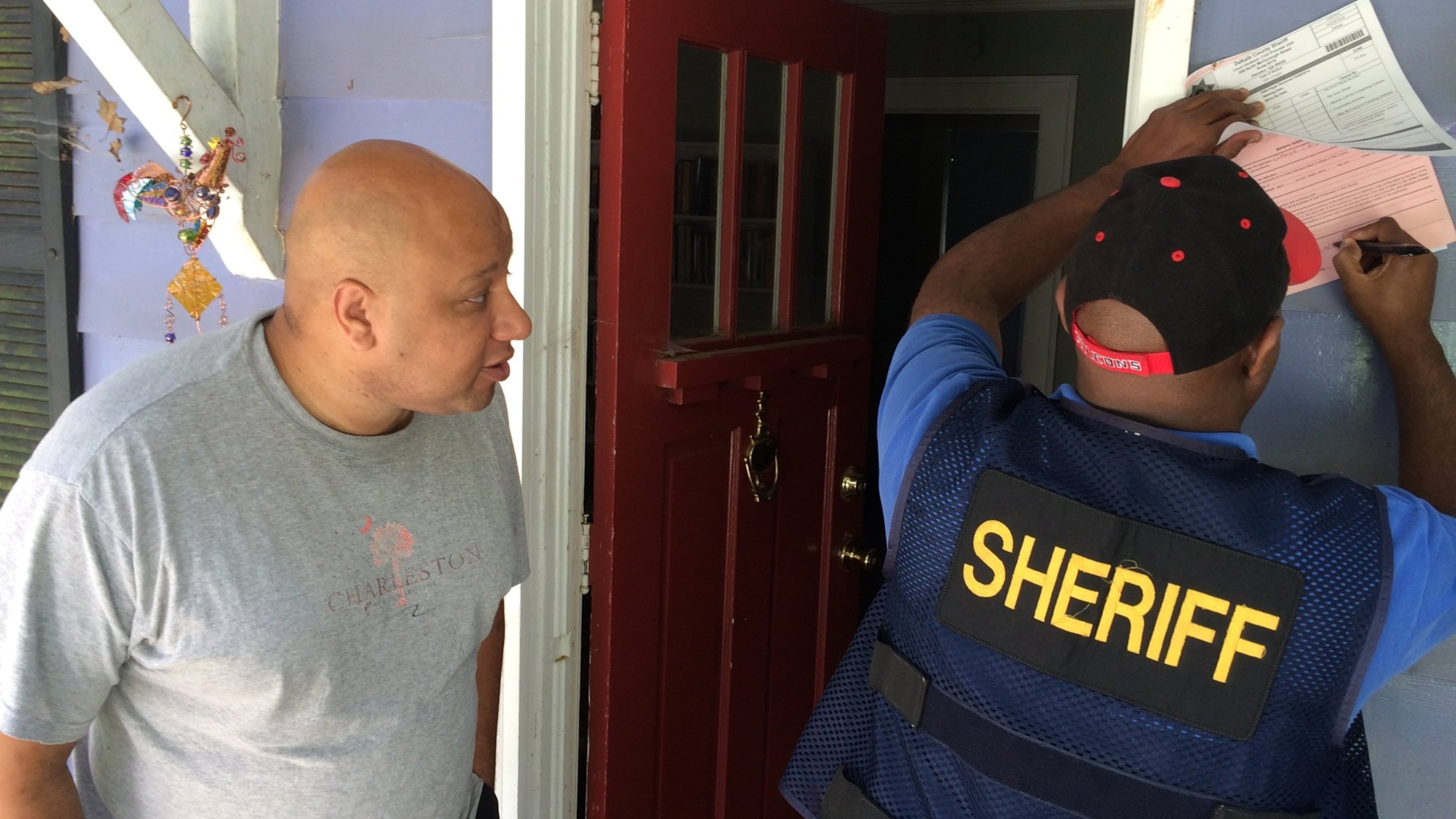 George Chidi, a contributor to the news blog “Peach Pundit,” expresses his amazement as he is served with a contempt of court motion following a restraining order he got from a candidate running for DeKalb County office. BILL TORPY BTORPY@AJC.COM