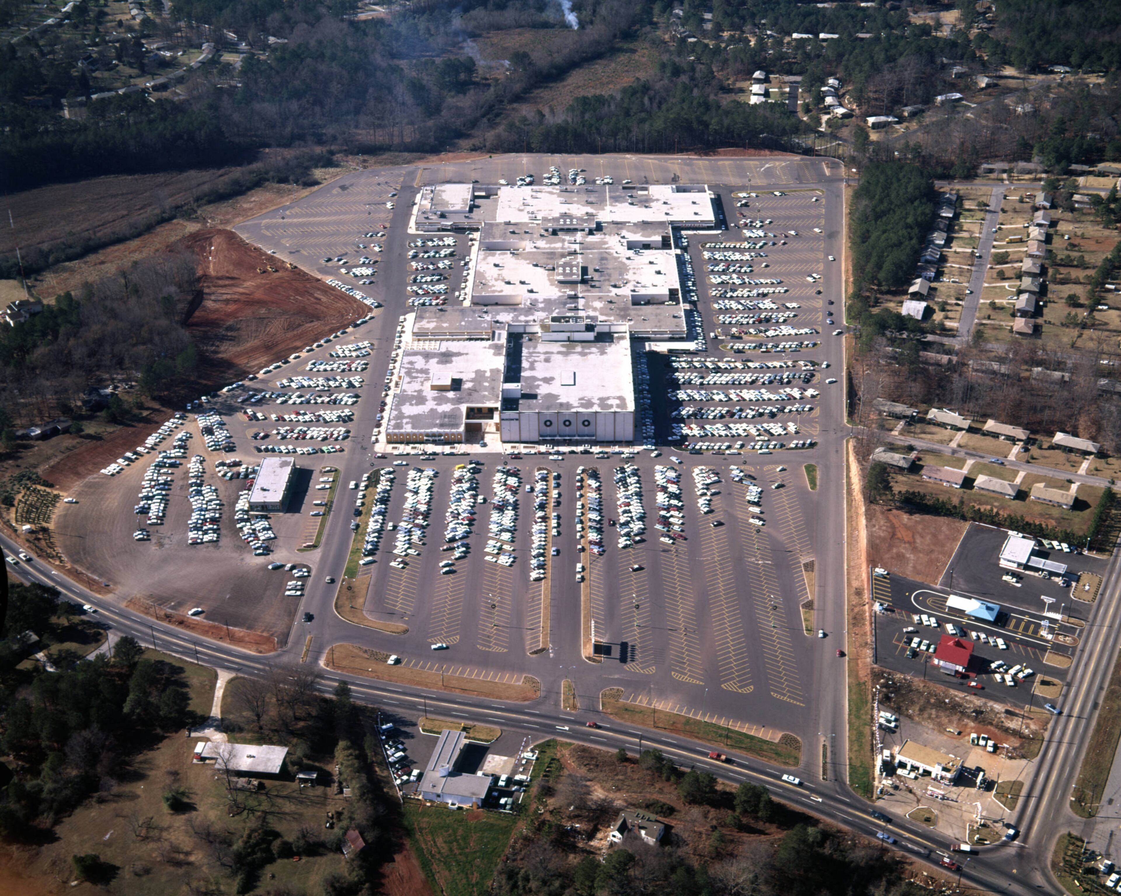 Aerial view of North DeKalb Mall and its surrounding parking lot, Atlanta, Georgia, December 21, 1965. At the Intersection of Lawrenceville Highway and North Druid Hills Road