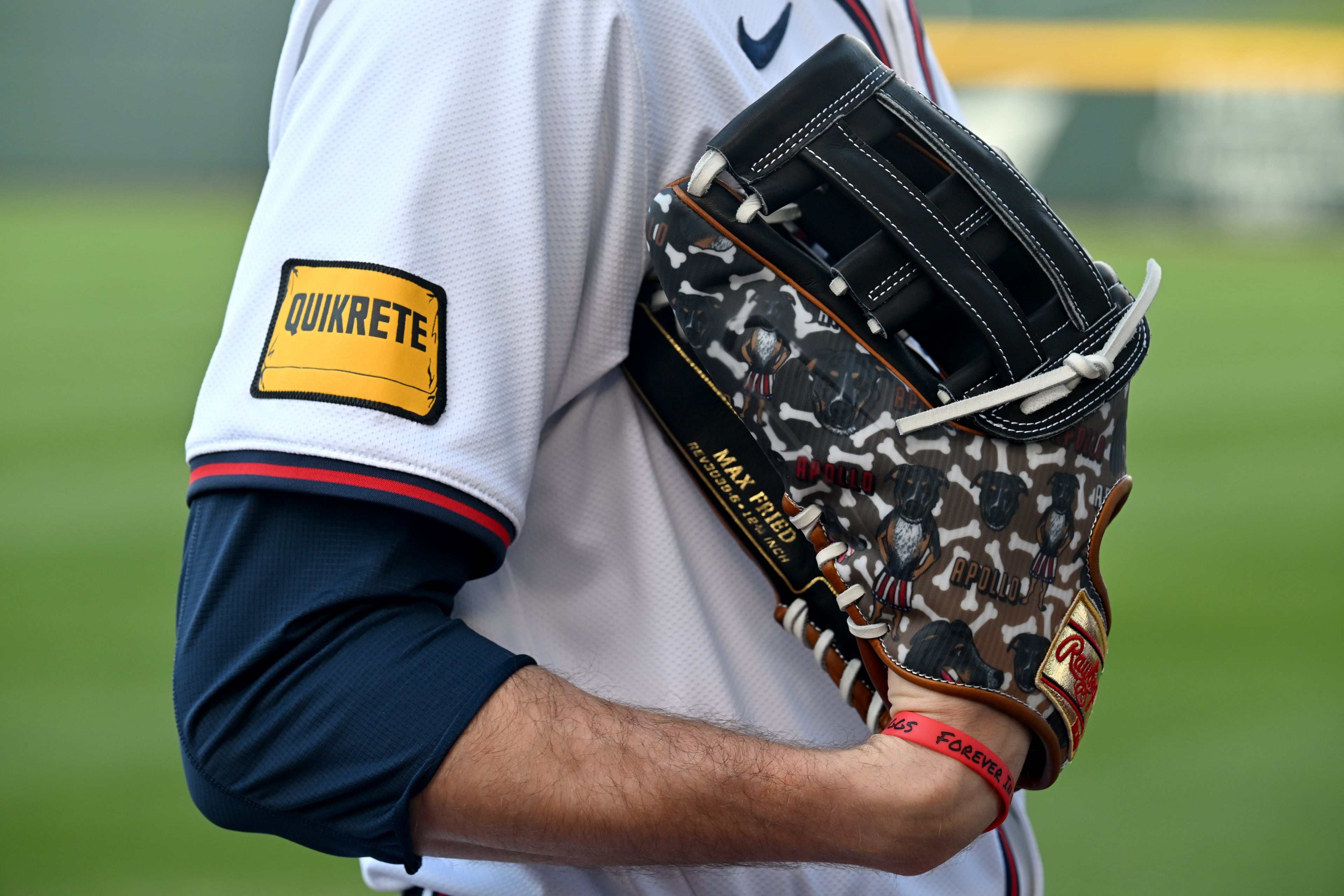 Atlanta Braves starting pitcher Max Fried holds a customized glove with drawing of his puppy as he waits for his turn during the team's photo day at CoolToday Park, Friday, Feb. 23, 2024, in North Port, Florida. (Hyosub Shin / Hyosub.Shin@ajc.com)