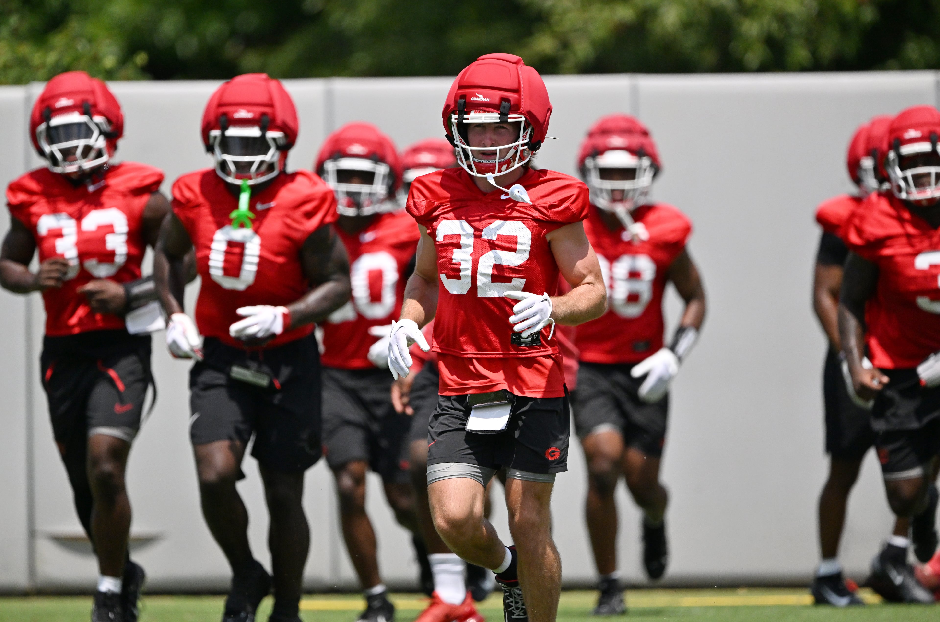Georgia running back Cash Jones (32) and other players participate in a football practice at the University of Georgia practice facility, Thursday, July 31, 2025, in Athens. (Hyosub Shin / AJC)