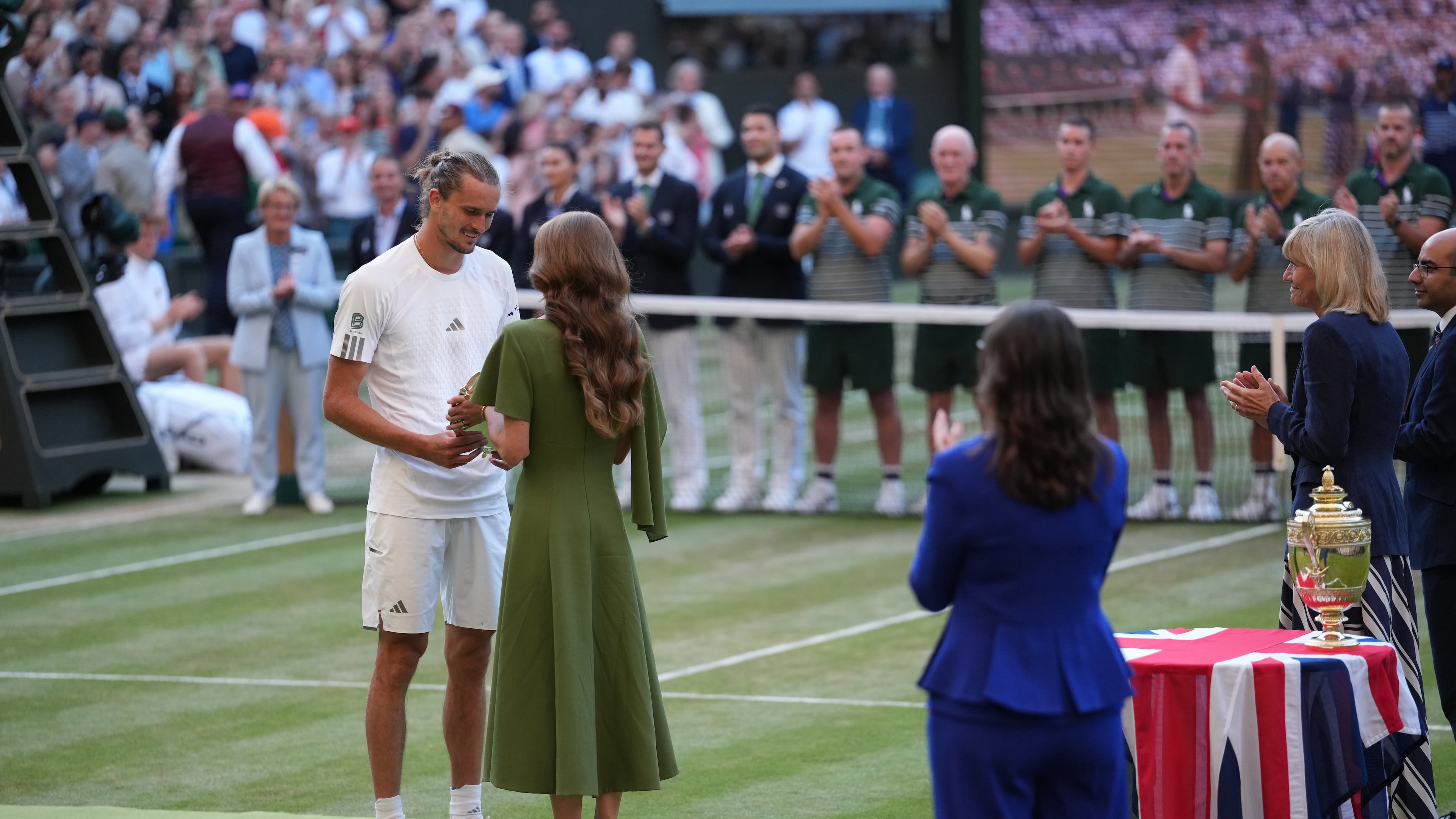 Britain's Princess Kate presents the runner-up trophy to Alexander Zverev of Germany after his match against Jannik Sinner of Italy in the men's singles final at Wimbledon Tennis Championships in London, Sunday, July 12, 2026. (AP Photo/Kirsty Wigglesworth)