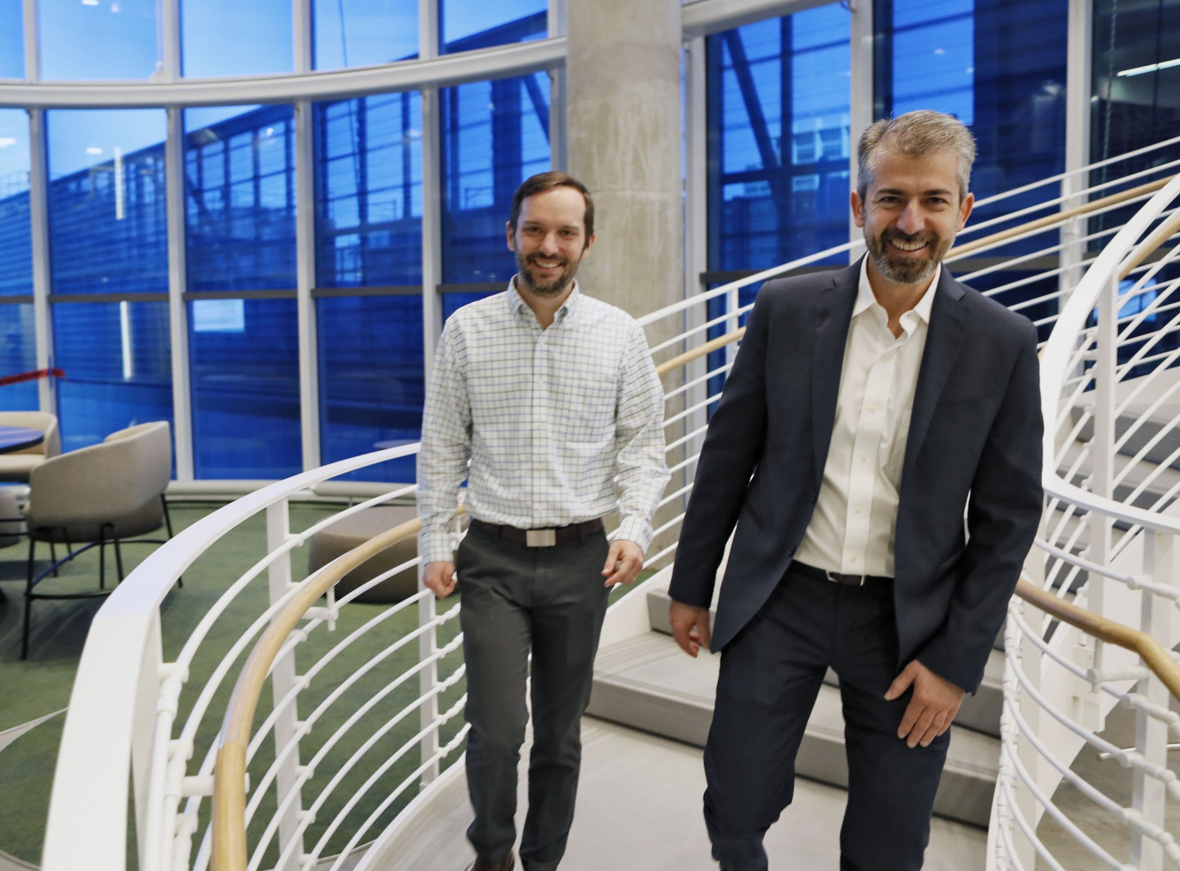 Architect Luca Maffey (right), and project manager Jonathan Mickle, from John Portman & Associates, descend the spiral staircase in the “Collaborative Core” of the Coda project at Georgia Tech. (The Coda team is still putting finishing touches on the interior and exterior of the building. The project's final look will be unveiled in May.)
