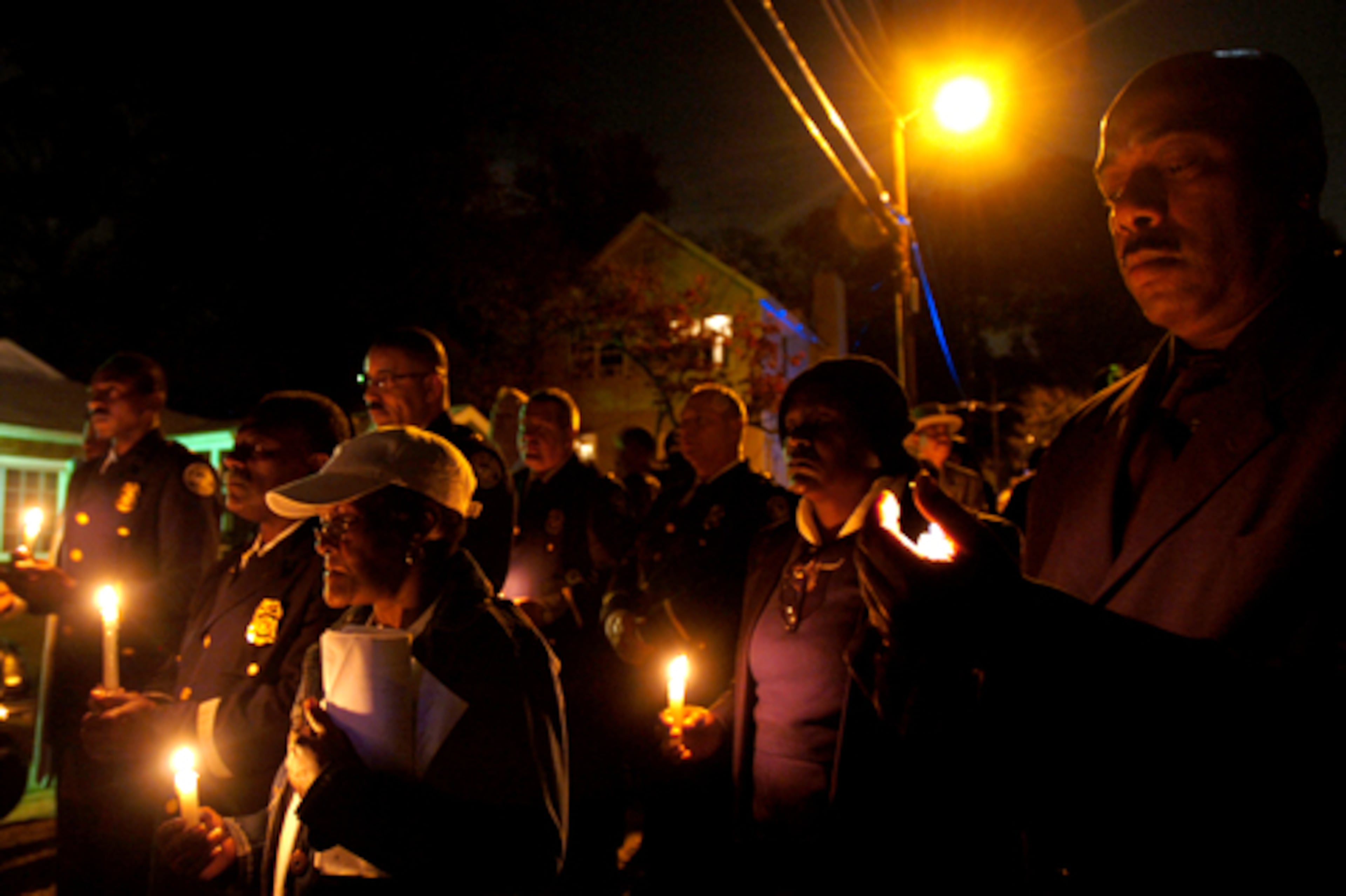 Community members hold a candlelight vigil Nov. 21, 2007, on Neal Street.