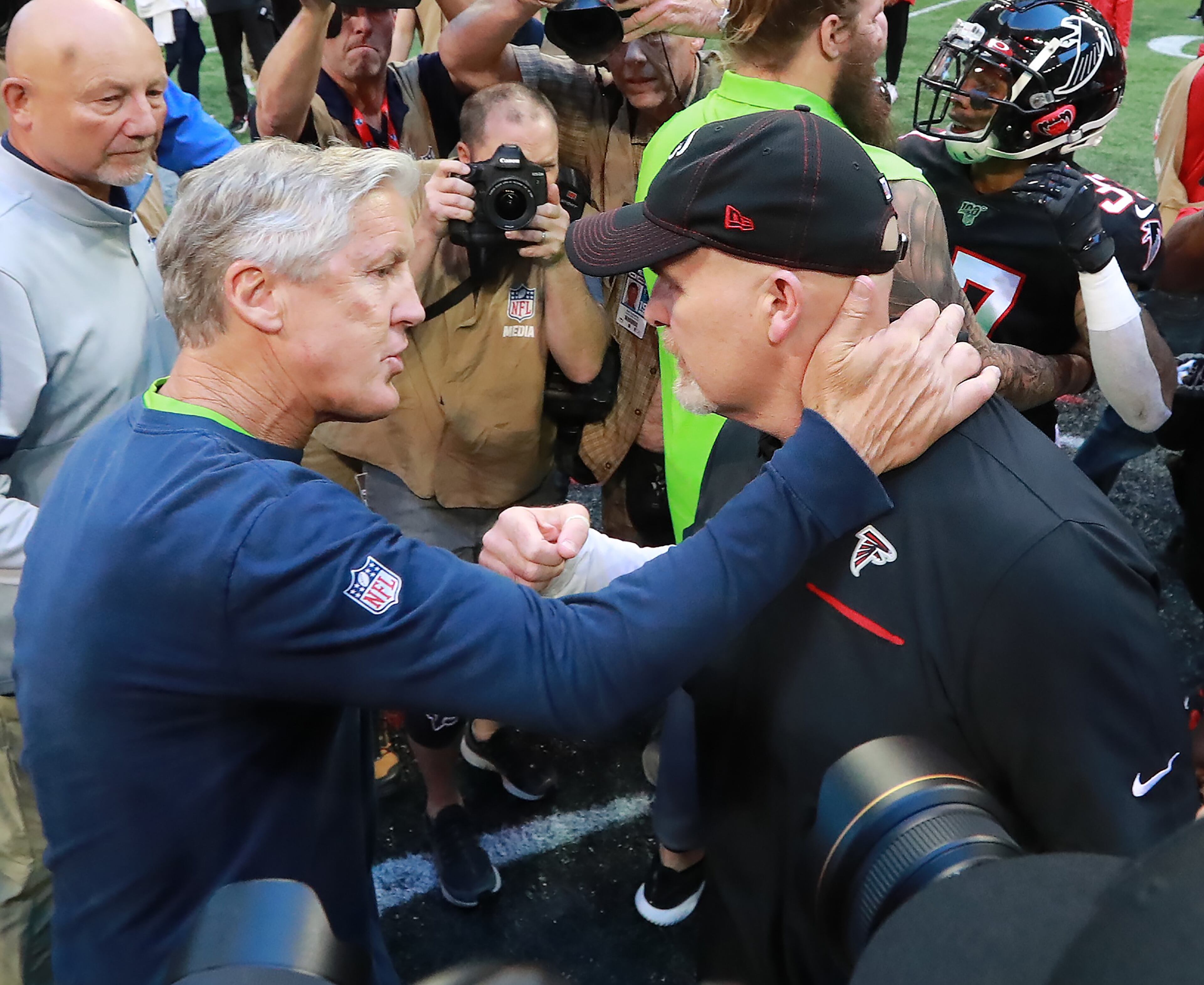 October 27, 2019 Atlanta: Atlanta Falcons head coach Dan Quinn and Seattle Seahawks head coach Pete Carroll greet each other at midfield after the Seahawks beat the Falcons 27-20 in an NFL football game on Sunday, October 27, 2019, in Atlanta. Curtis Compton/ccompton@ajc.com