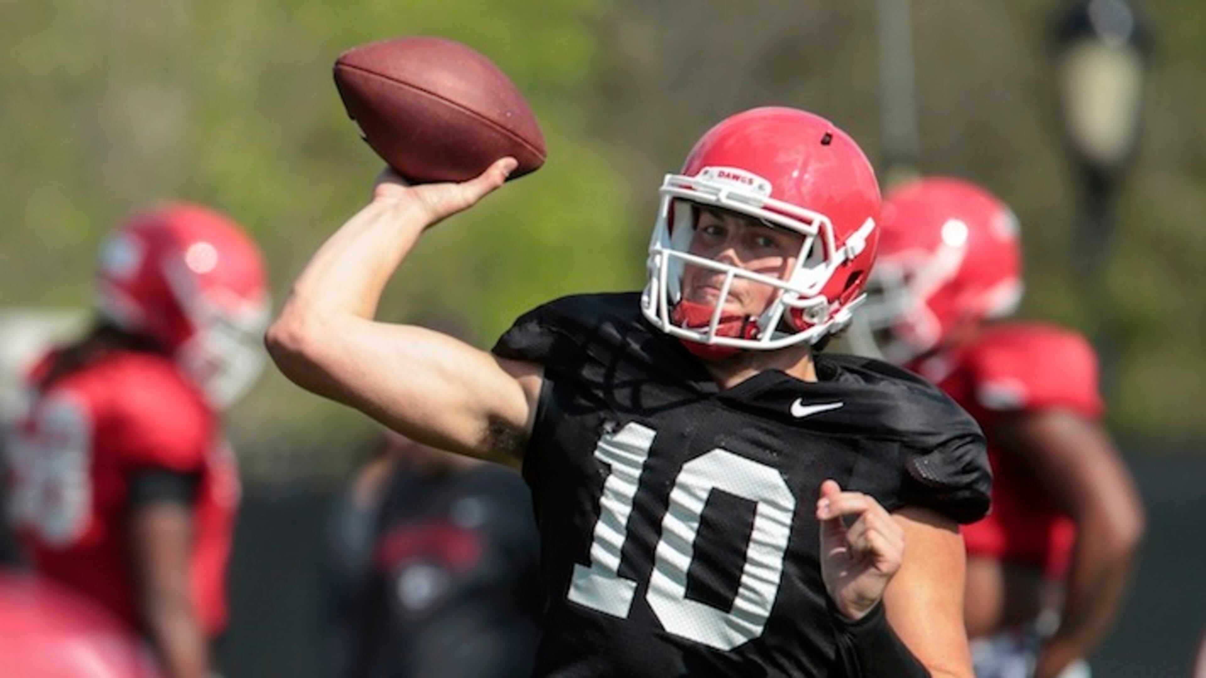 Georgia quarterback Jacob Eason (10) throws down-field during spring NCAA college practice in Athens, Ga., Tuesday, March 28, 2017. (John Roark/Athens Banner-Herald via AP)