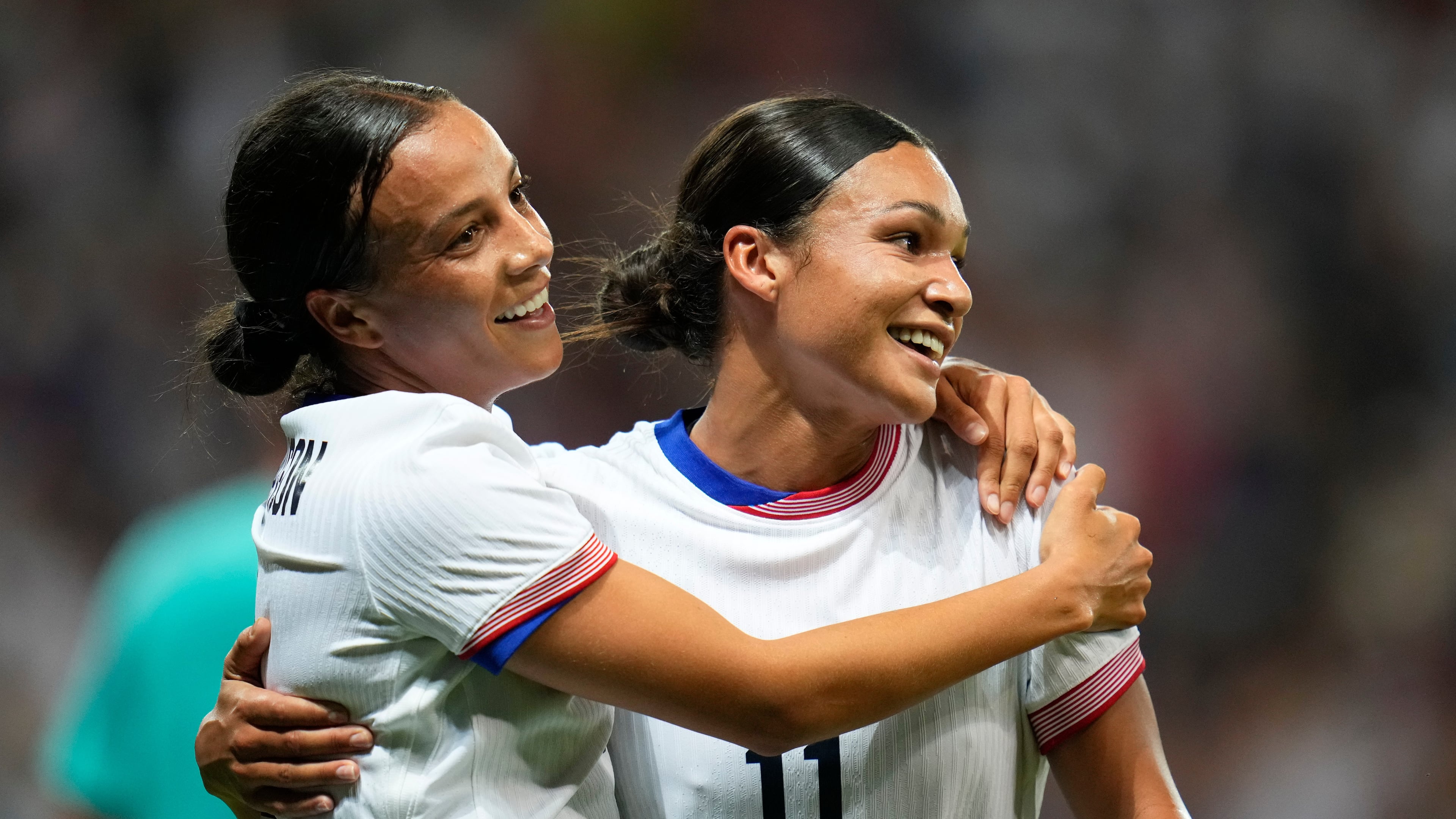 FILE - United States' Mallory Swanson, left, reacts with teammate Sophia Smith after scoring her side's third goal during a women's group B match between the United States and Zambia at Nice Stadium at the 2024 Summer Olympics, July 25, 2024, in Nice, France. (AP Photo/Julio Cortez, File)