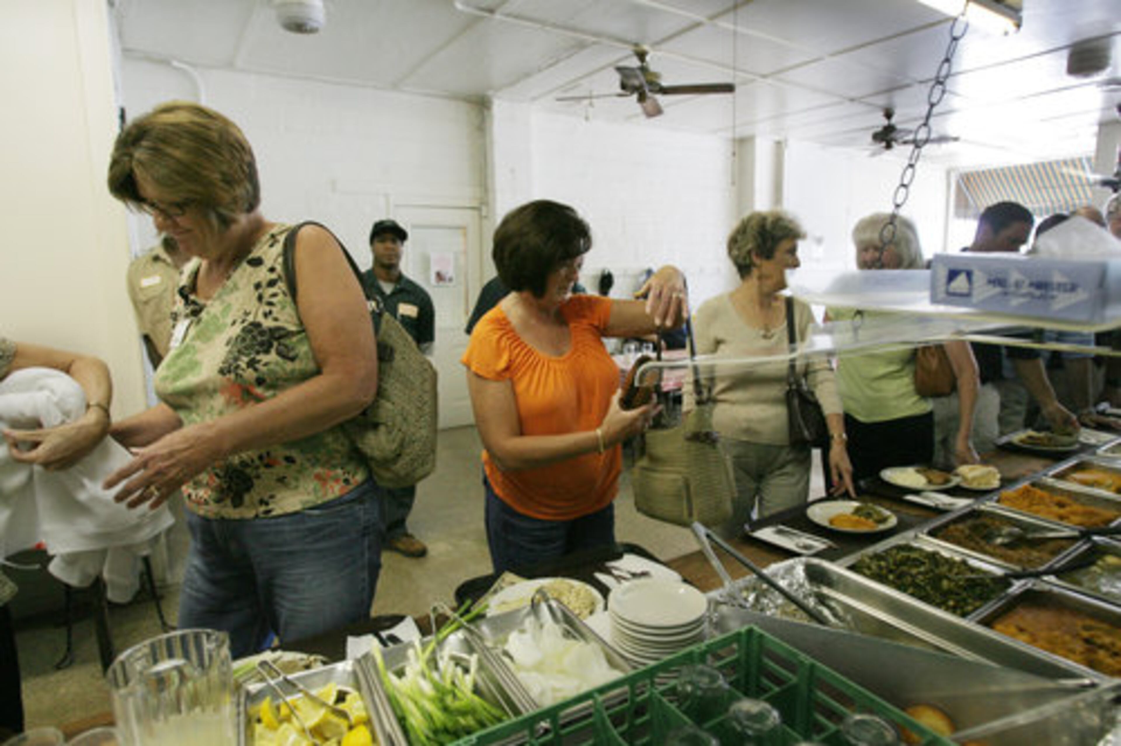 Matthew's Cafeteria in Tucker helped the Food Network break new ground on its show "Diners, Drive-Ins and Dives." The family-owned business is the first cafeteria to be featured on the show. Diane Mitchell, Shirley Vaughnn, Brenda Turpin and Jean Shumake make their selections, which isn't easy since the menu is filled with good comfort food.