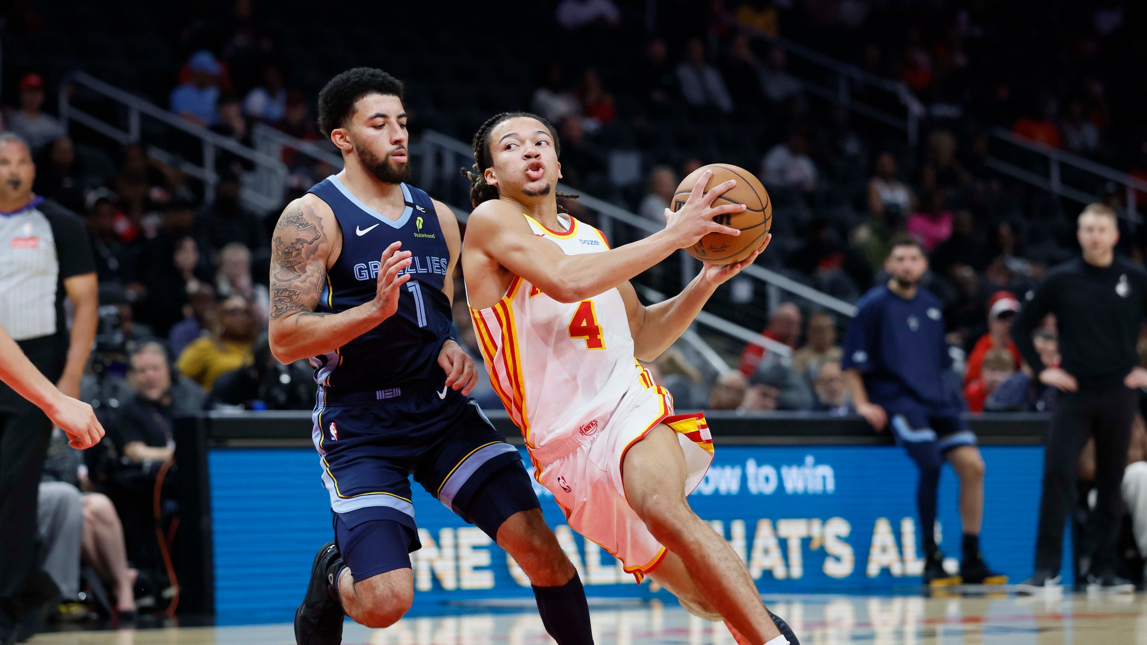 Hawks guard Kingston Flemings (right) drives past Memphis Grizzlies guard Scotty Pippen Jr. during a preseason game at State Farm Arena in Atlanta on Monday, Oct. 5, 2026. (Miguel Martinez/AJC)