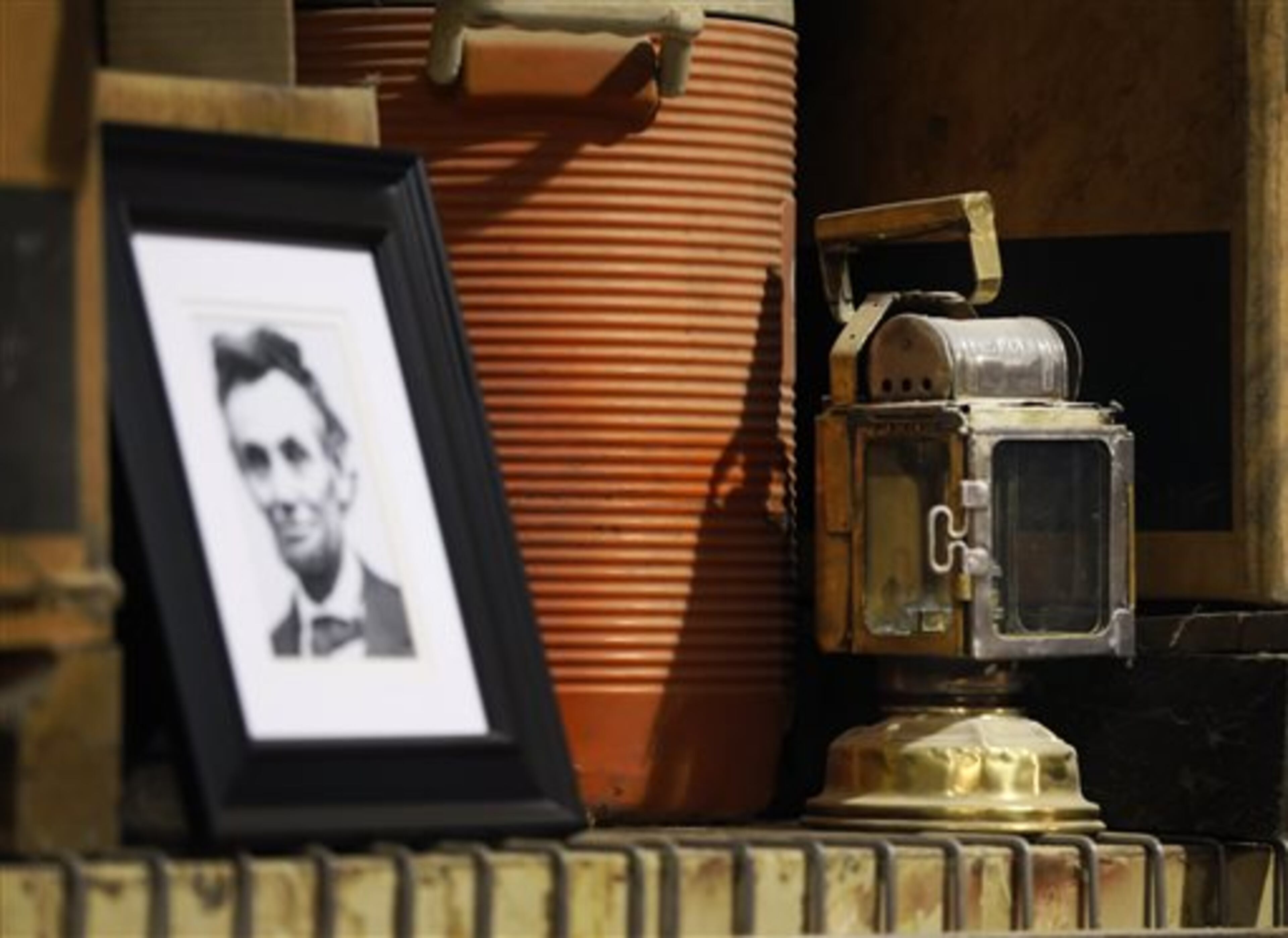 This Thursday, April 2, 2015 photo shows a lamp, believed to be one of two that were on the original train car that carried President Abraham Lincoln's coffin along the 1600-mile route from Washington, D.C. to Springfield, Ill., in Elgin, Ill. Dave Kloke is building a replica of the train car, from the truck assembly to the car itself. (AP Photo/Charles Rex Arbogast)