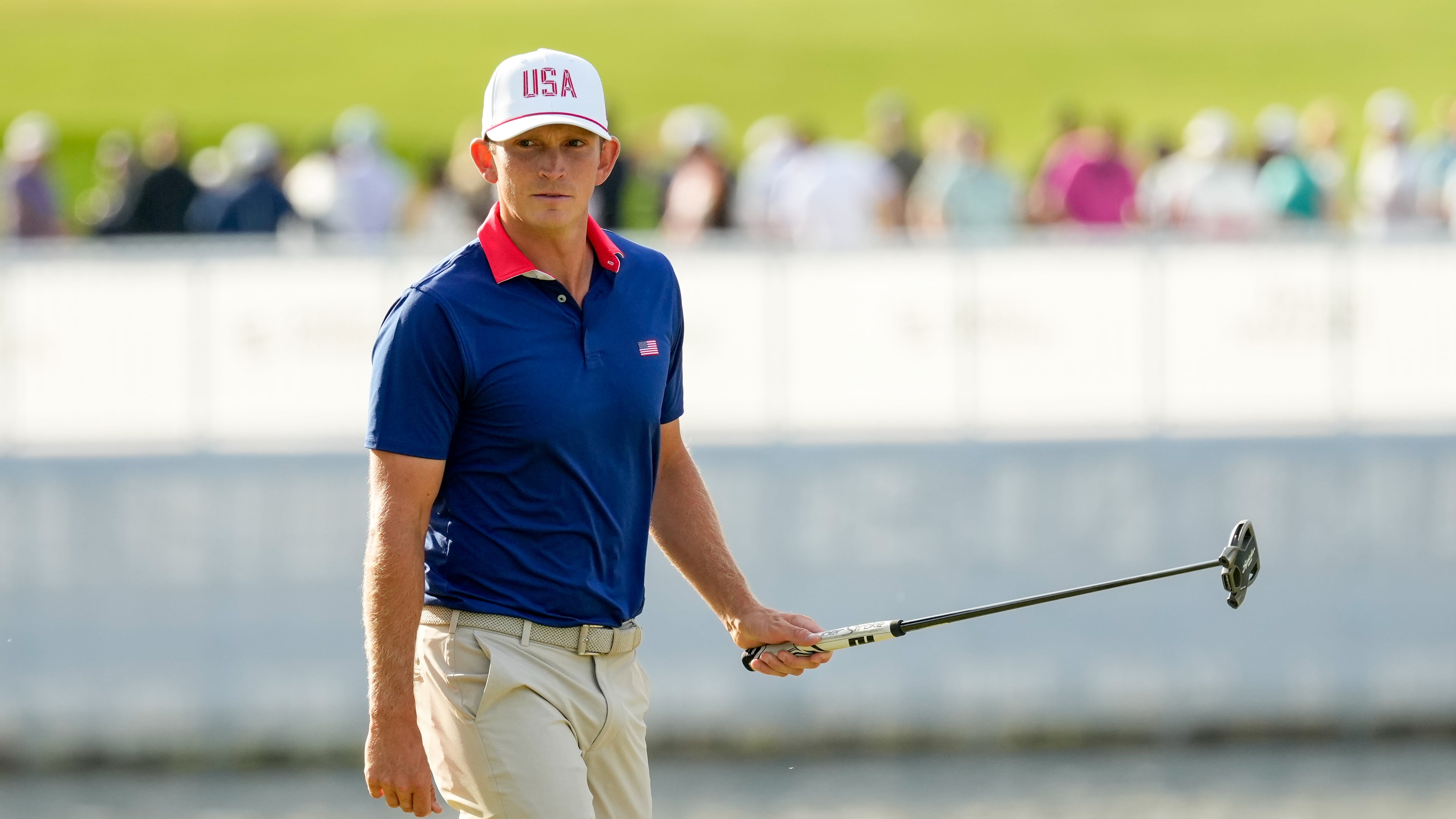 USA teams' Jacob Bridgeman watches his shot on the 13th green against the International team during a Presidents Cup golf tournament third round foursome match at Medinah Country Club, Saturday, Sept. 26, 2026, in Medinah, Ill. (AP Photo/Chris Carlson)