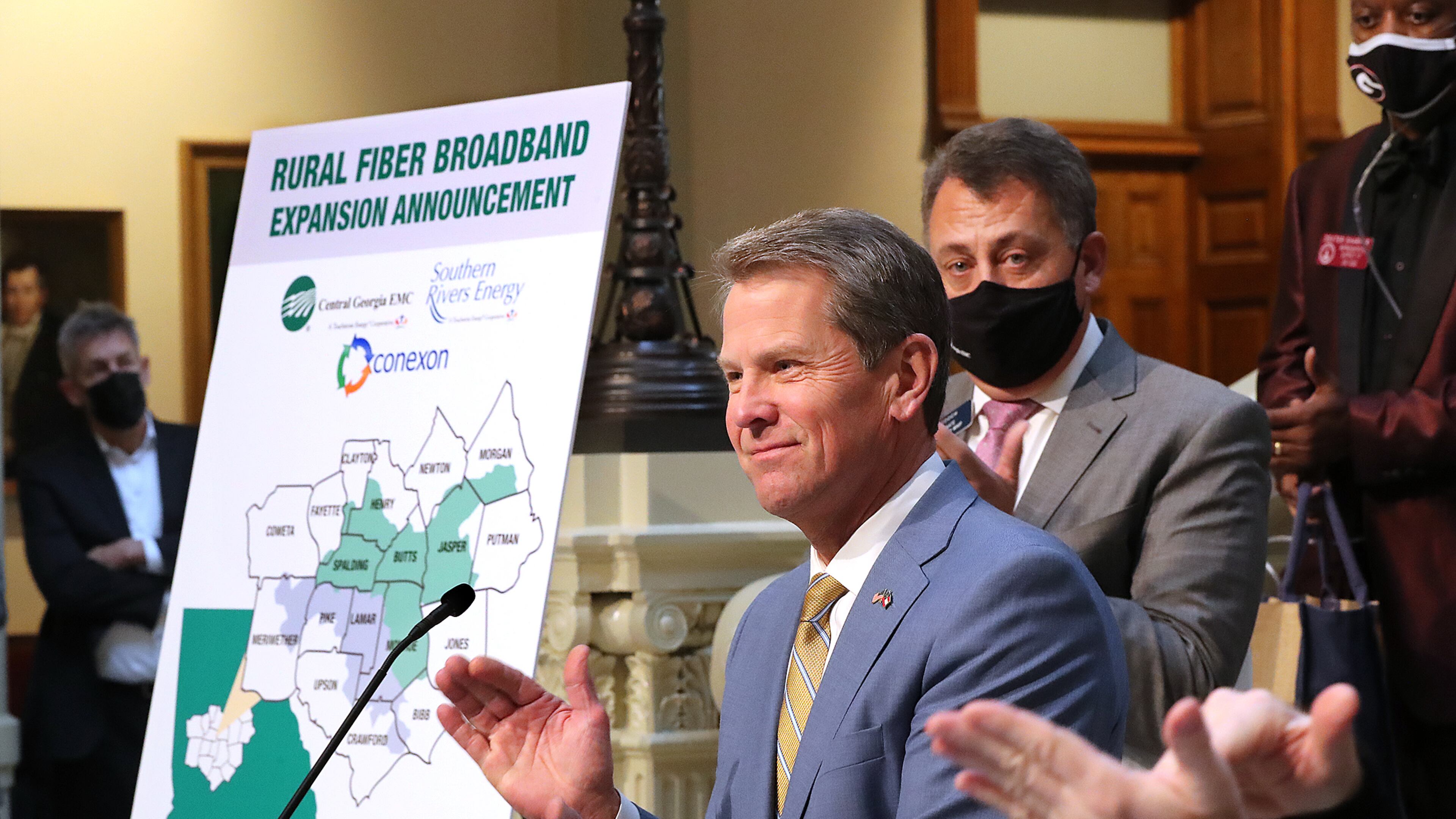 Gov. Brian Kemp applauds while speaking Monday during a press conference about expanding rural internet access in Georgia at the Capitol in Atlanta. Curtis Compton / Curtis.Compton@ajc.com”