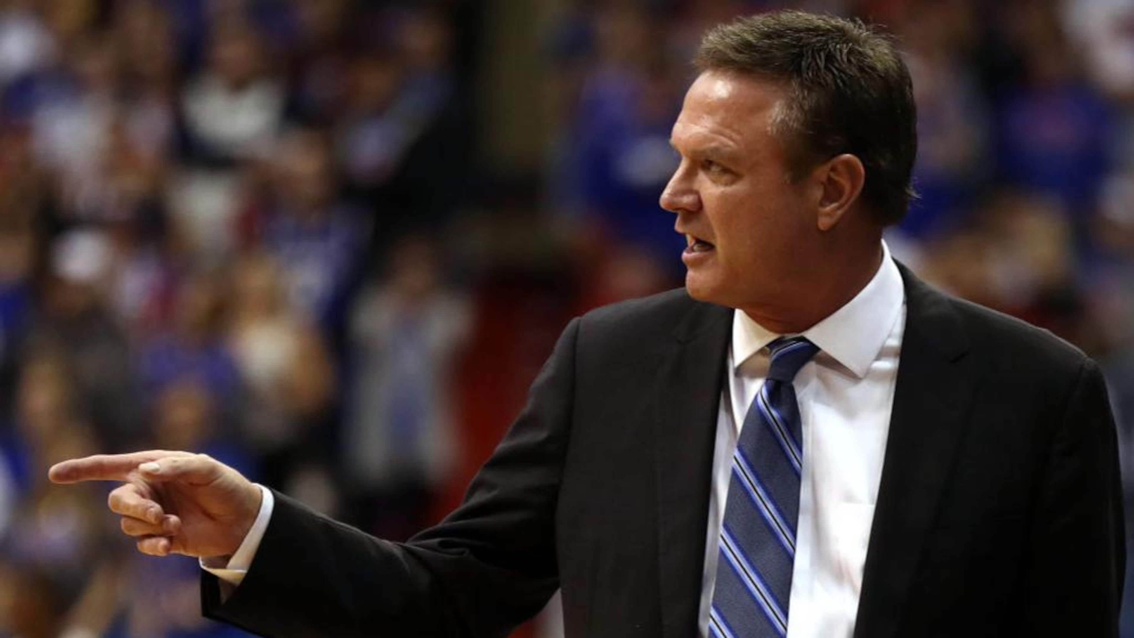 Kansas basketball coach Bill Self met a longtime fan after Satruday's game, giving 102-year-old Hattie Long a kiss on the cheek.