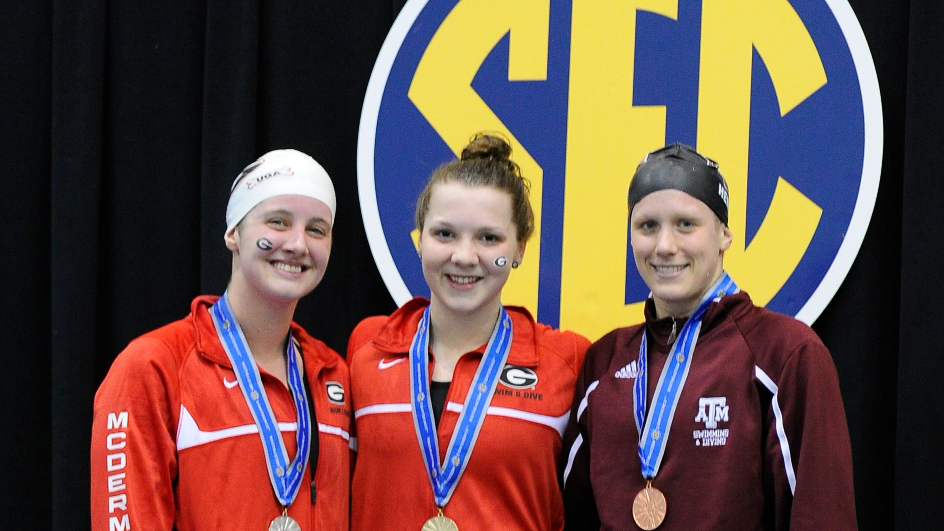 Brittany MacLean (center) wins the 1650 yard freestyle during day five of the SEC Swimming and Diving Championships finals held at the Gabrielsen Natatorium on Saturday, Feb. 22, 2014 in Athens, Ga.