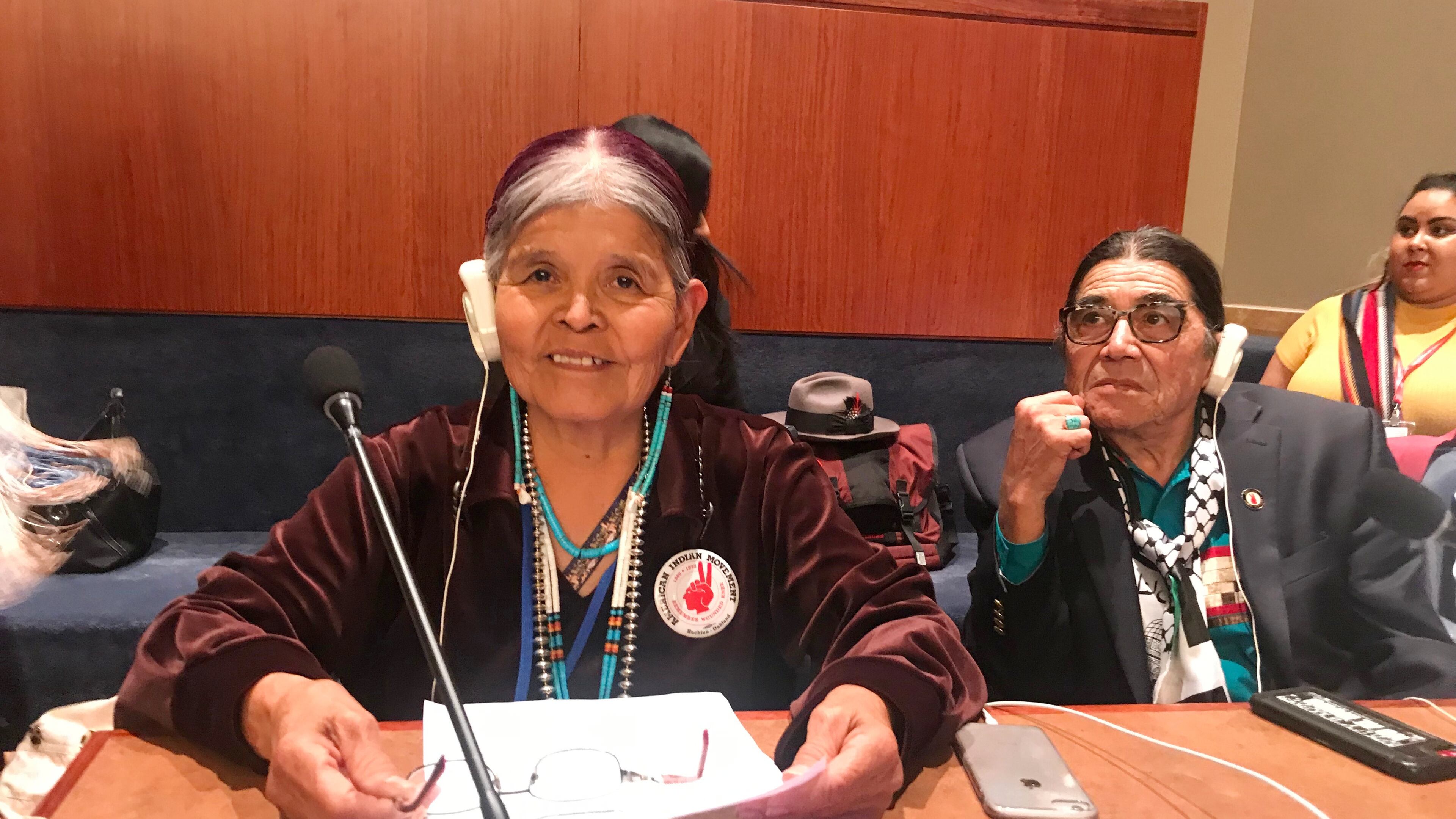 Jean Whitehorse testifies about forced and coerced sterilization of Native American women at the United Nations Permanent Forum on Indigenous Issues on April 2019, as Anthony Gonzales, right, executive director of the American Indian Movement listens. (Keely Badger via AP)