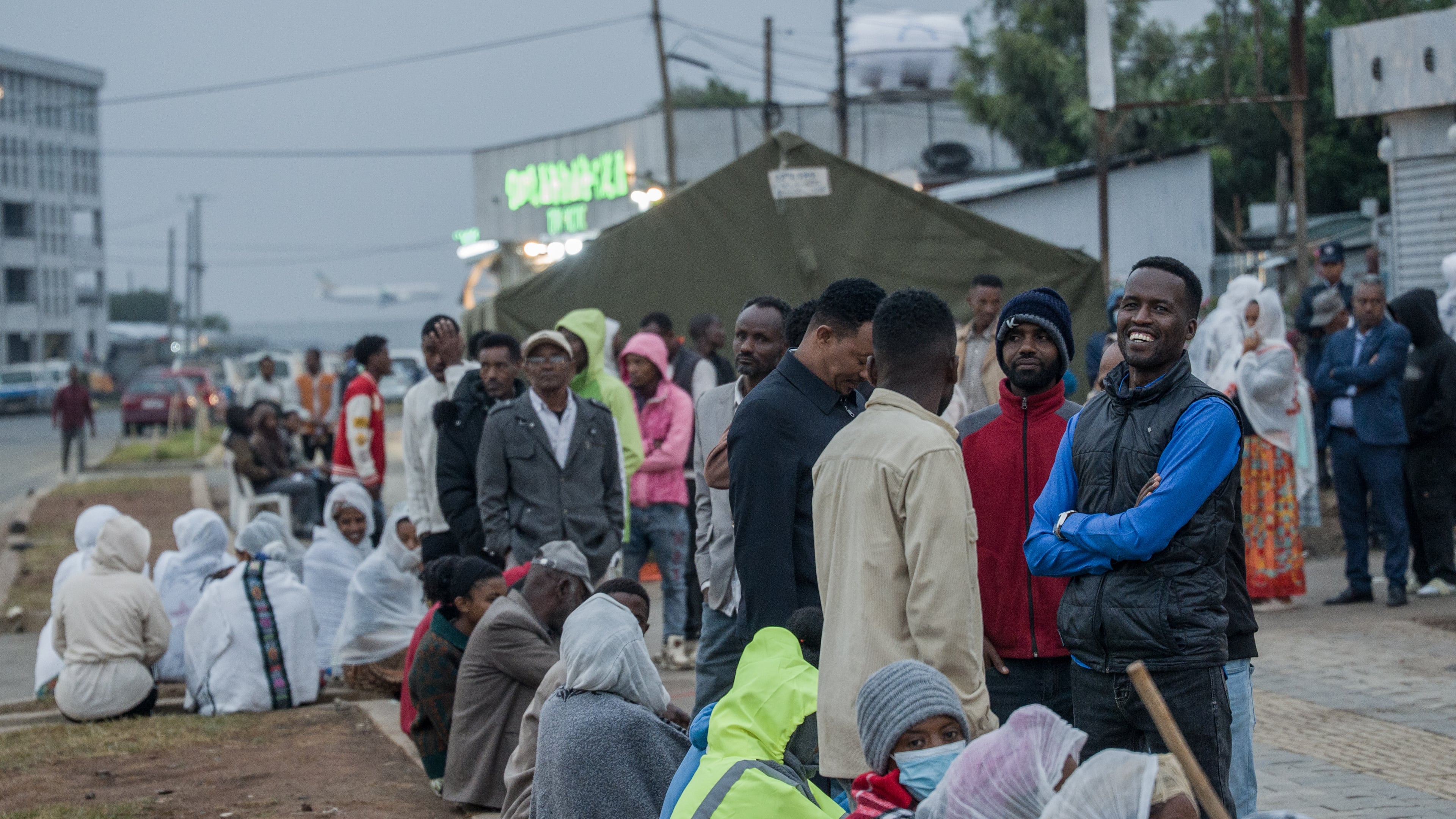 People gather outside a polling station before casting their votes in the general election in Addis Ababa, Ethiopia, Monday, June 1, 2026. (AP Photo/Amanuel Sileshi)