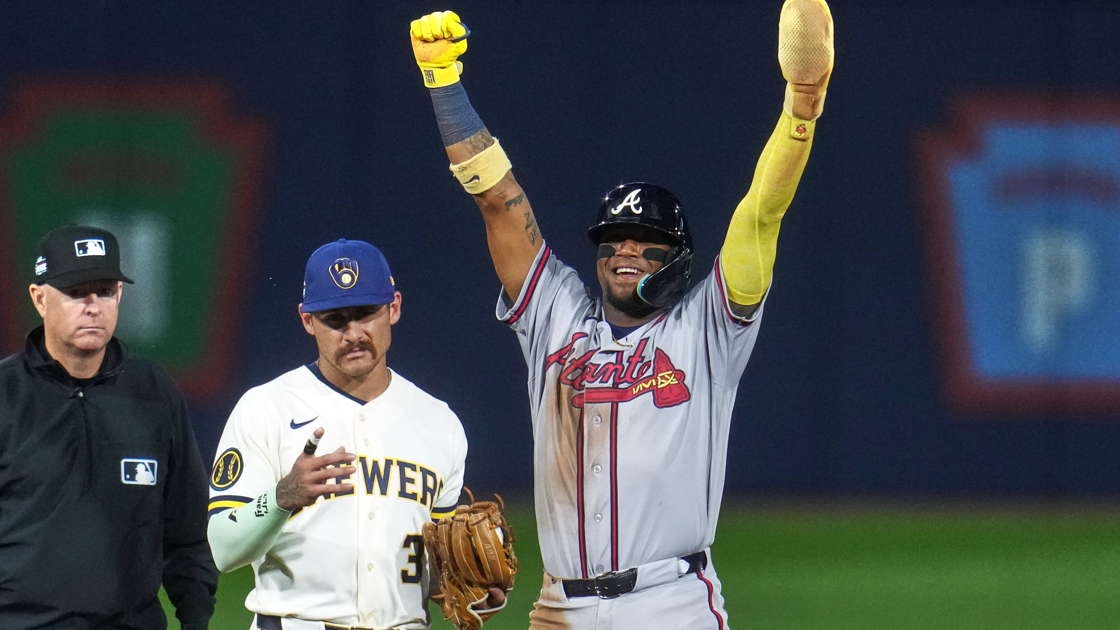 Atlanta Braves' Ronald Acuña Jr., right, celebrates next to Milwaukee Brewers shortstop Joey Ortiz (3) after stealing second base during the fifth inning of the Little League Classic baseball game in Williamsport, Pa., Sunday, Aug. 23, 2026. (AP Photo/Gene J. Puskar)